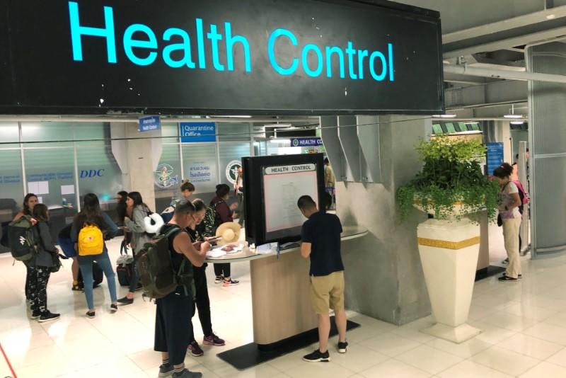 Tourist line up in a health control at the arrival section at Suvarnabhumi international airport in Bangkok, Jan. 19, 2020.