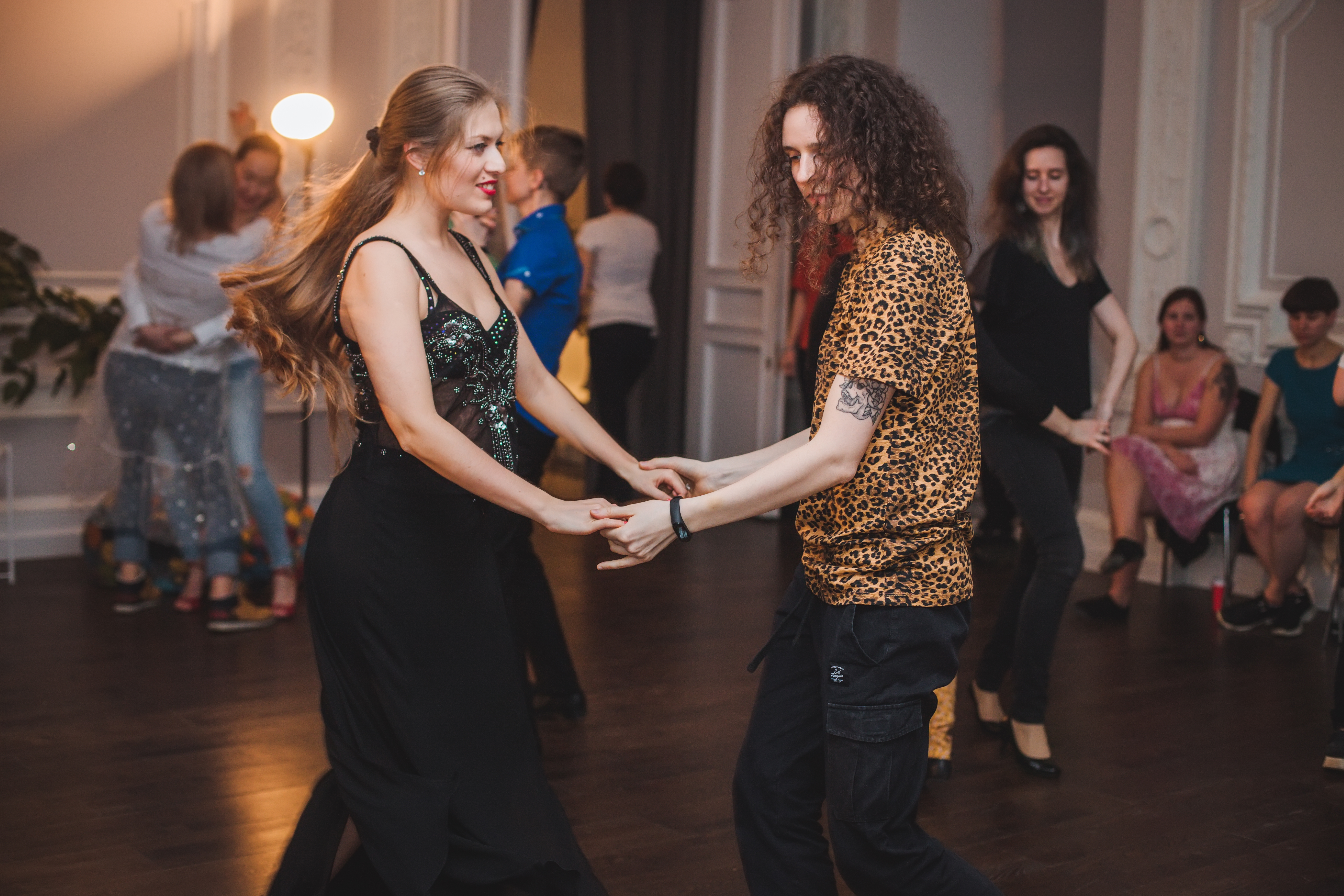 Two people dance at a studio