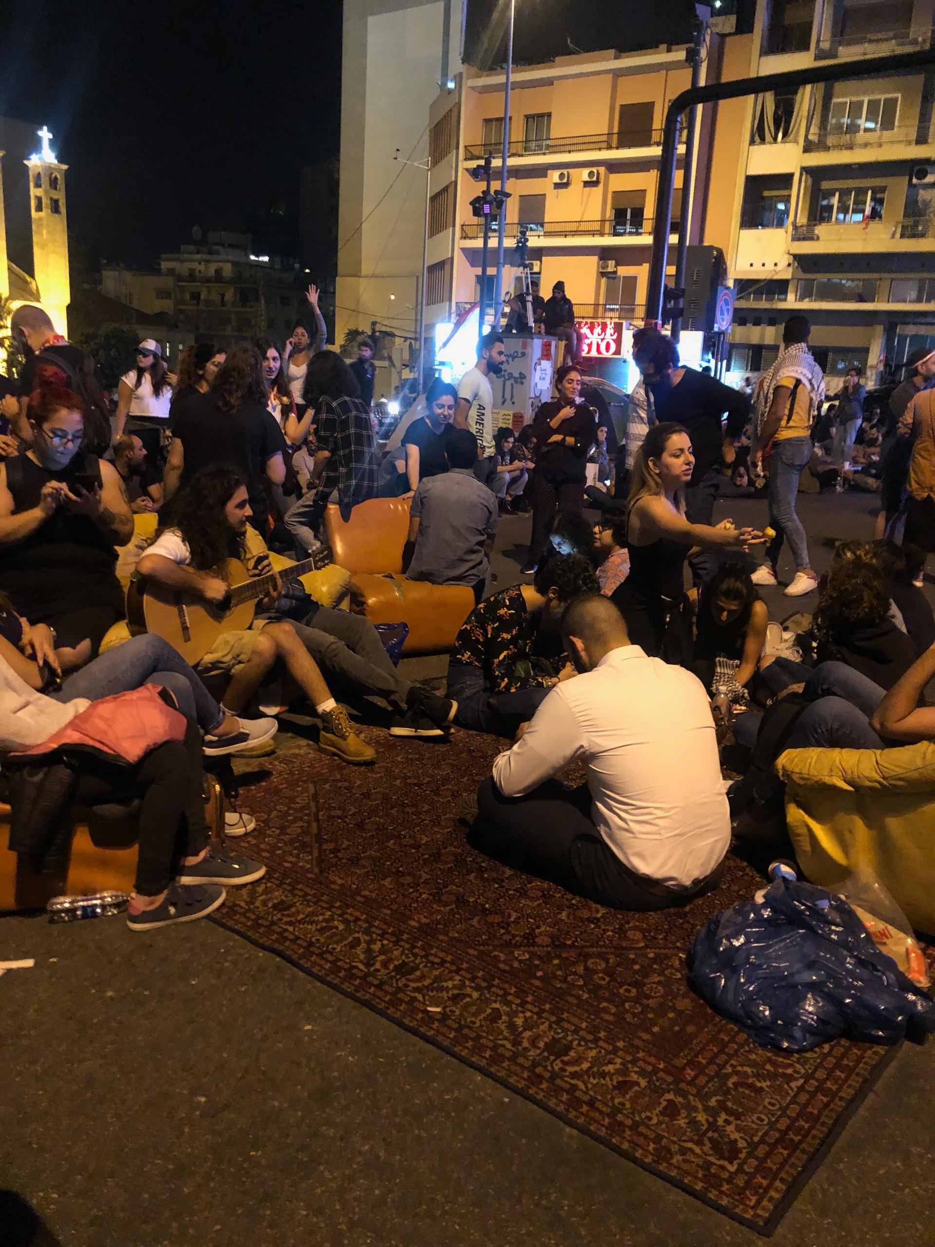 Protesters lay on a carpet as they block Beirut's Ring Bridge.