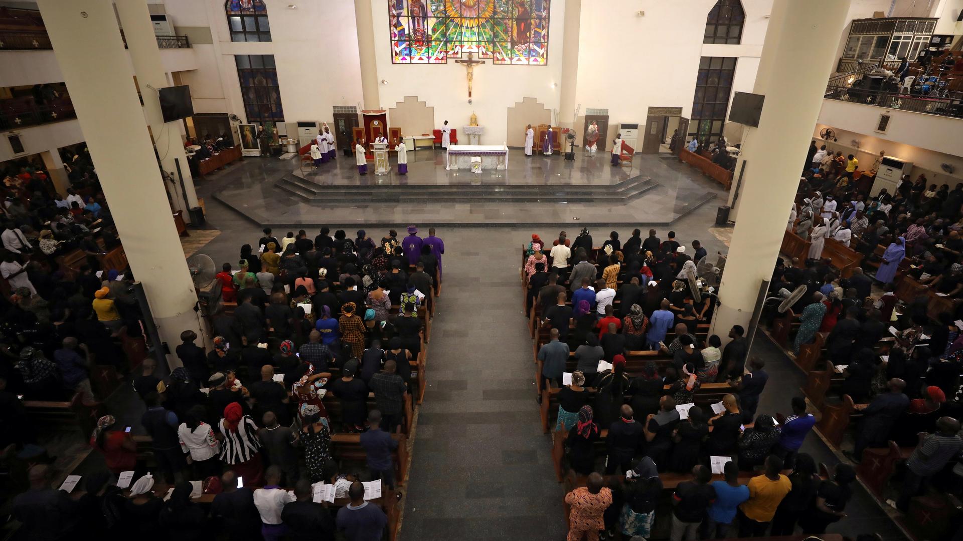 People attend Ash Wednesday mass in a church in Abuja, Nigeria, Feb. 26, 2020. 