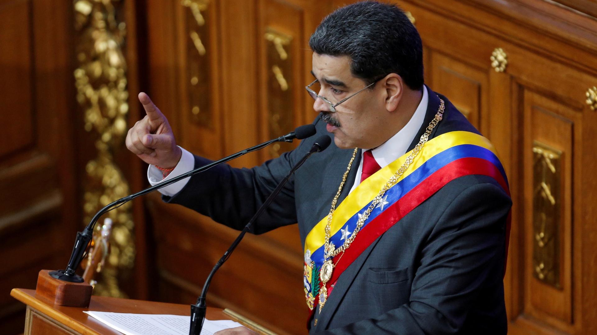 Venezuela's disputed President Nicolas Maduro gestures as he speaks during a special session of the National Constituent Assembly to deliver his annual state of the nation speech, in Caracas, Venezuela, Jan. 14, 2020. 