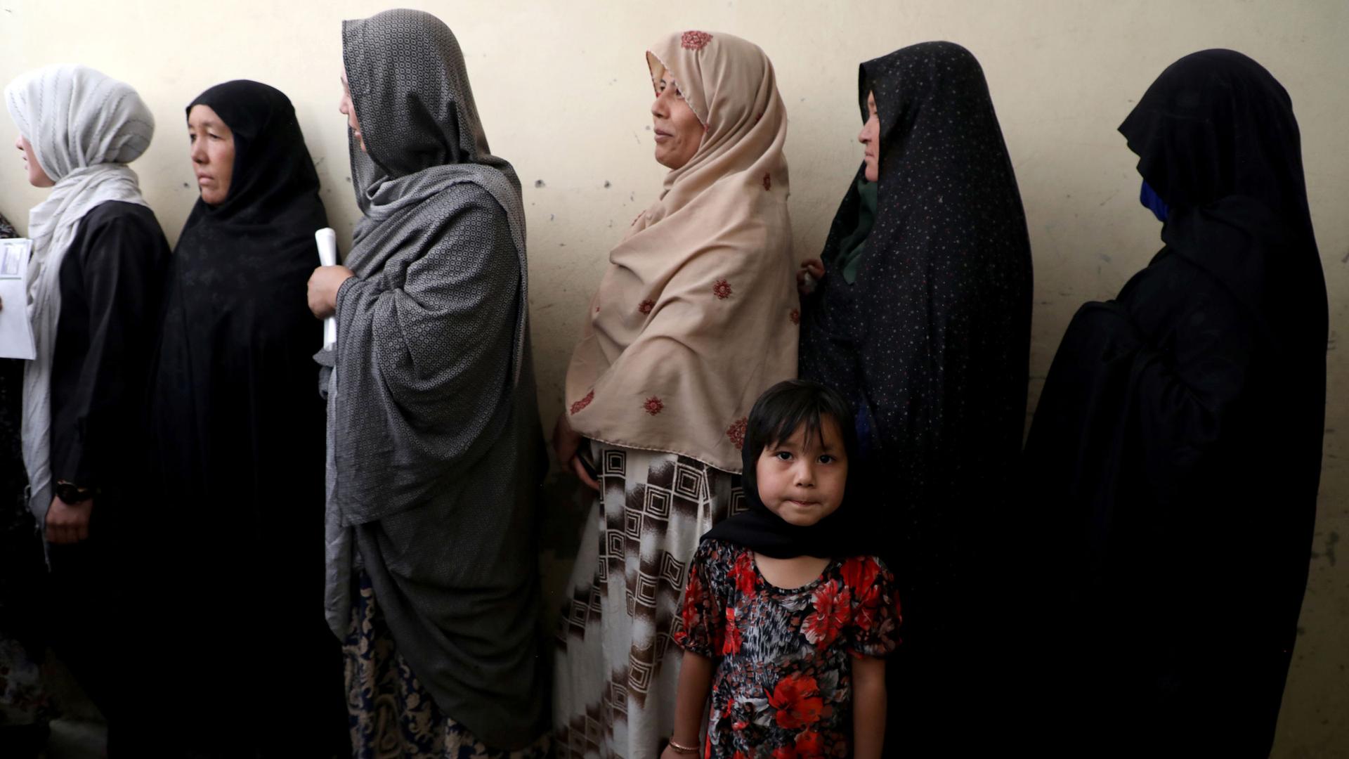 Afghan women line up at a polling station as they wait to cast their votes in Kabul, Afghanistan, on Sept. 28, 2019.