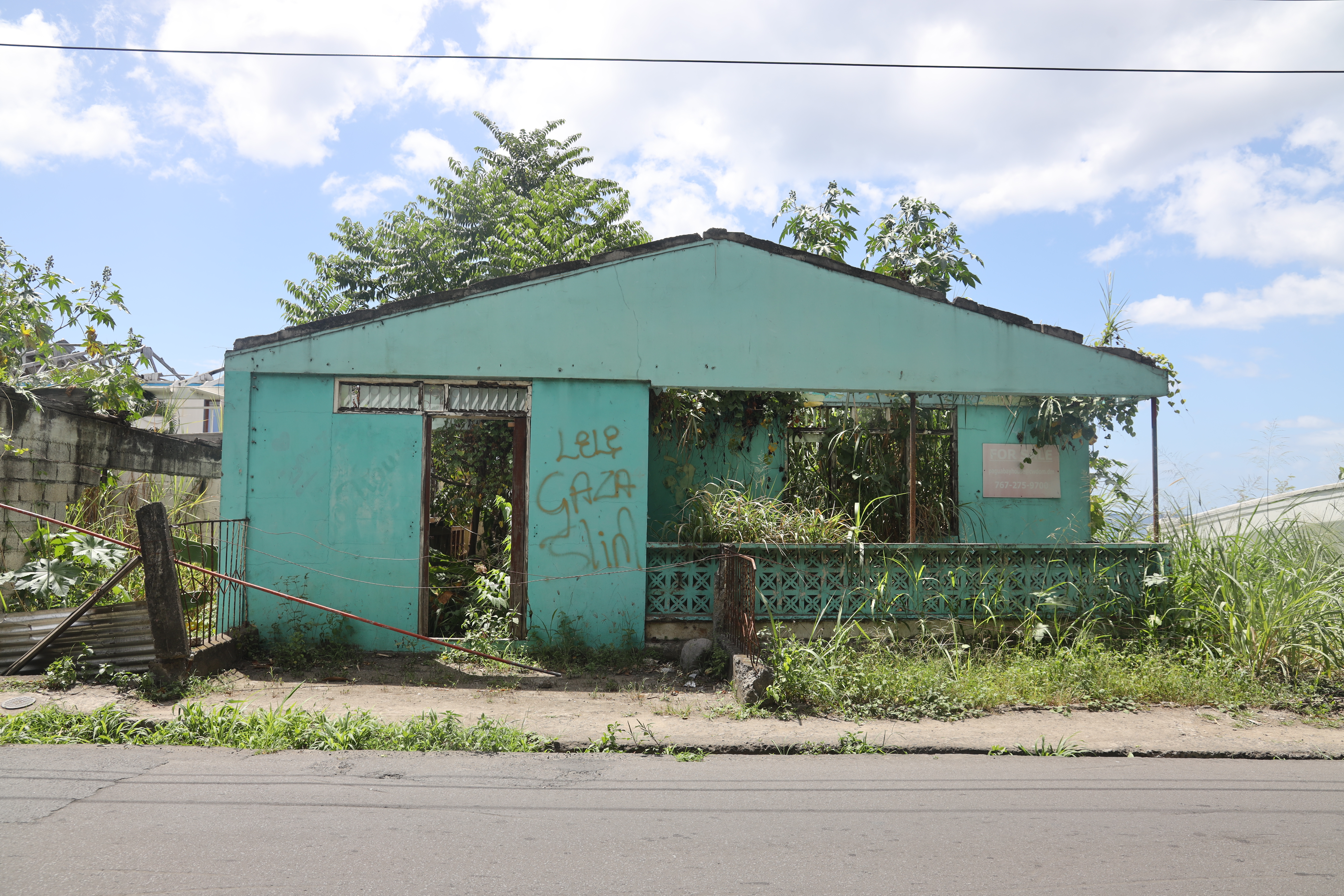 A home, damaged and abandoned, on the southwest coast of Dominica.