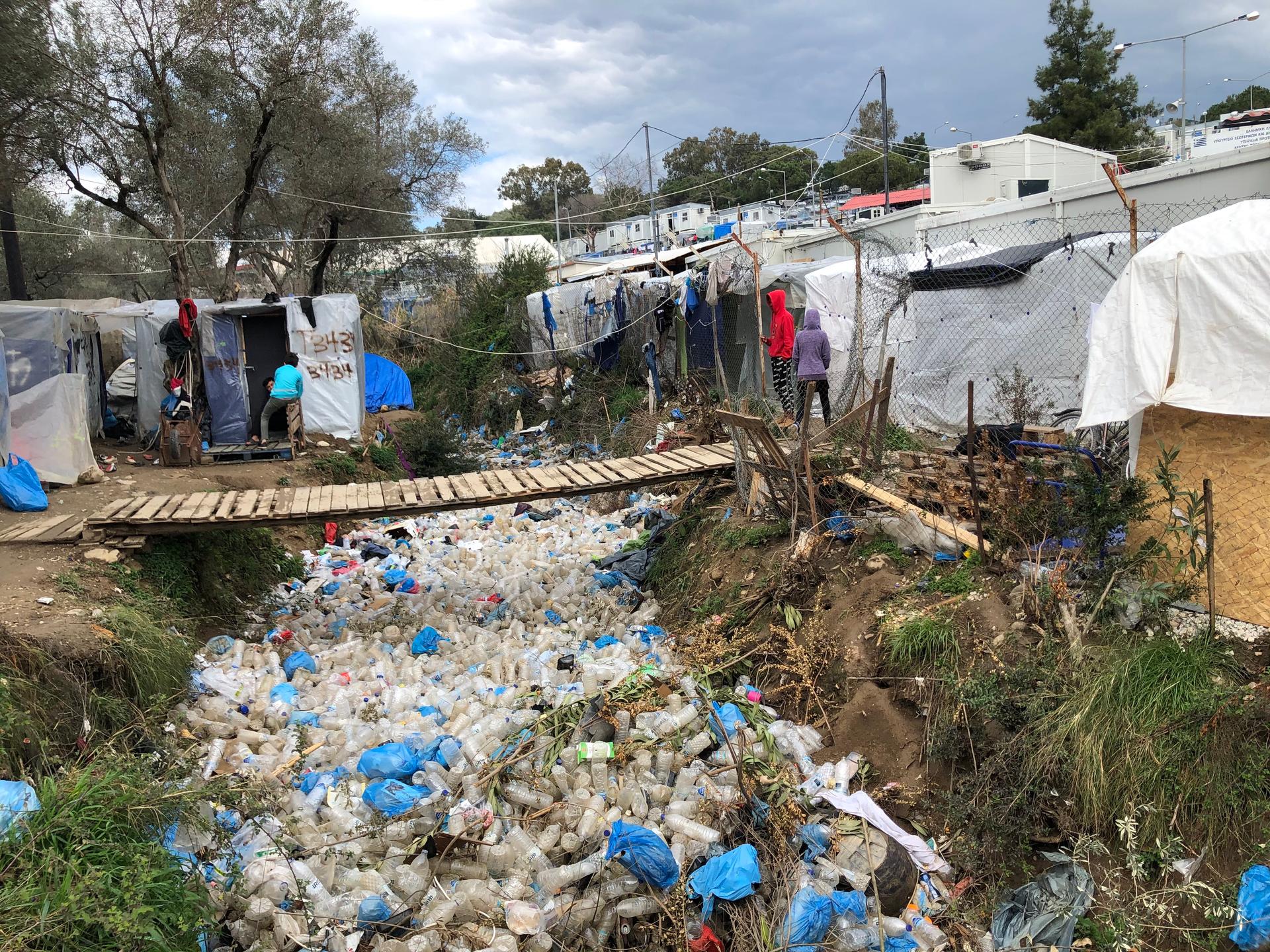 Garbage is strewn between tents in Moria, an overcrowded refugee camp on the Greek island of Lesbos.