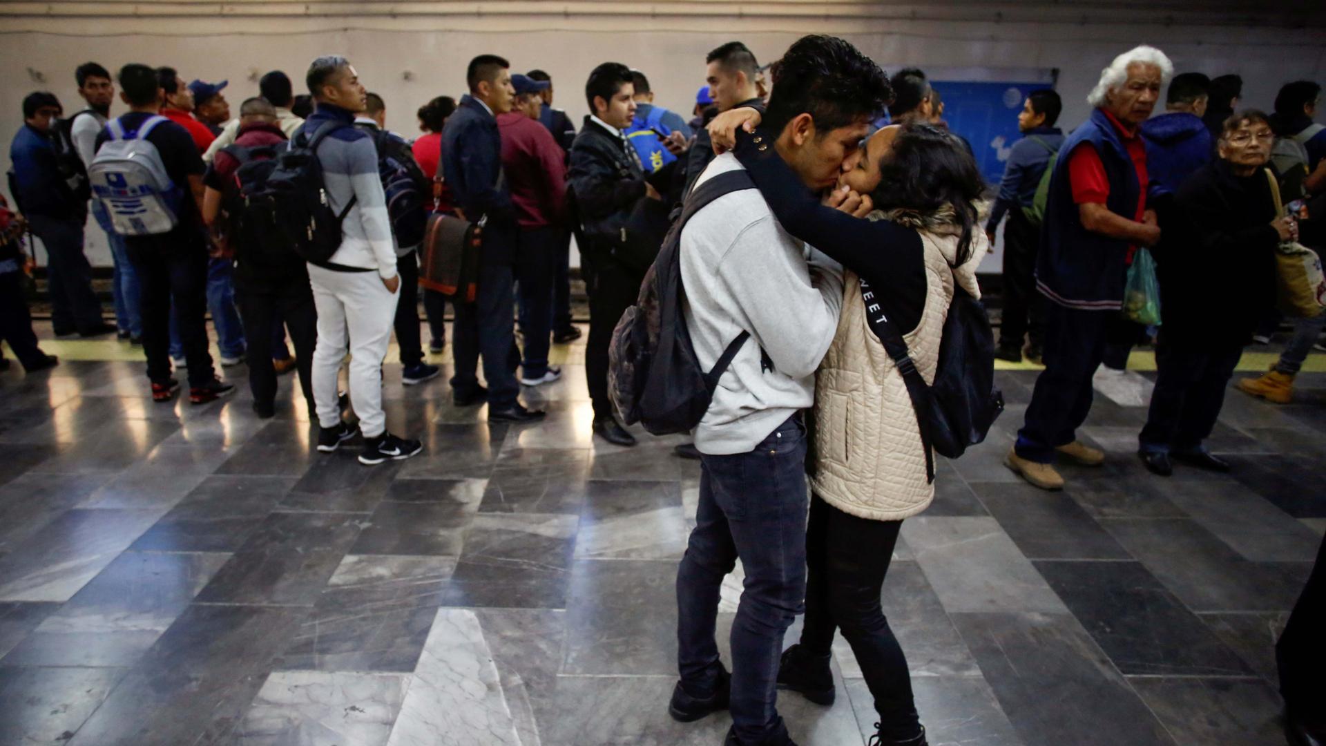 A couple kiss in the Pantitlan metro station as Mexico's government is seeking to minimize public disruption in its response to the coronavirus disease (COVID-19), in Mexico City, Mexico, on March 17, 2020.