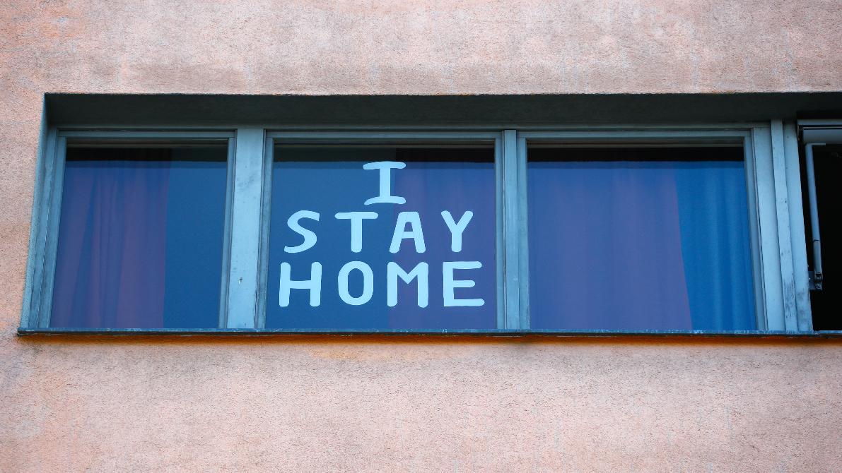a sign on the window reads, I stay home.