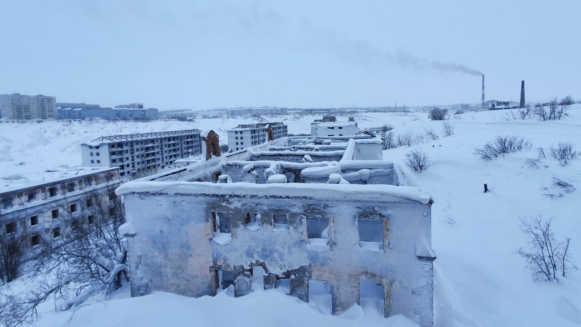 Abandoned snow-covered buildings