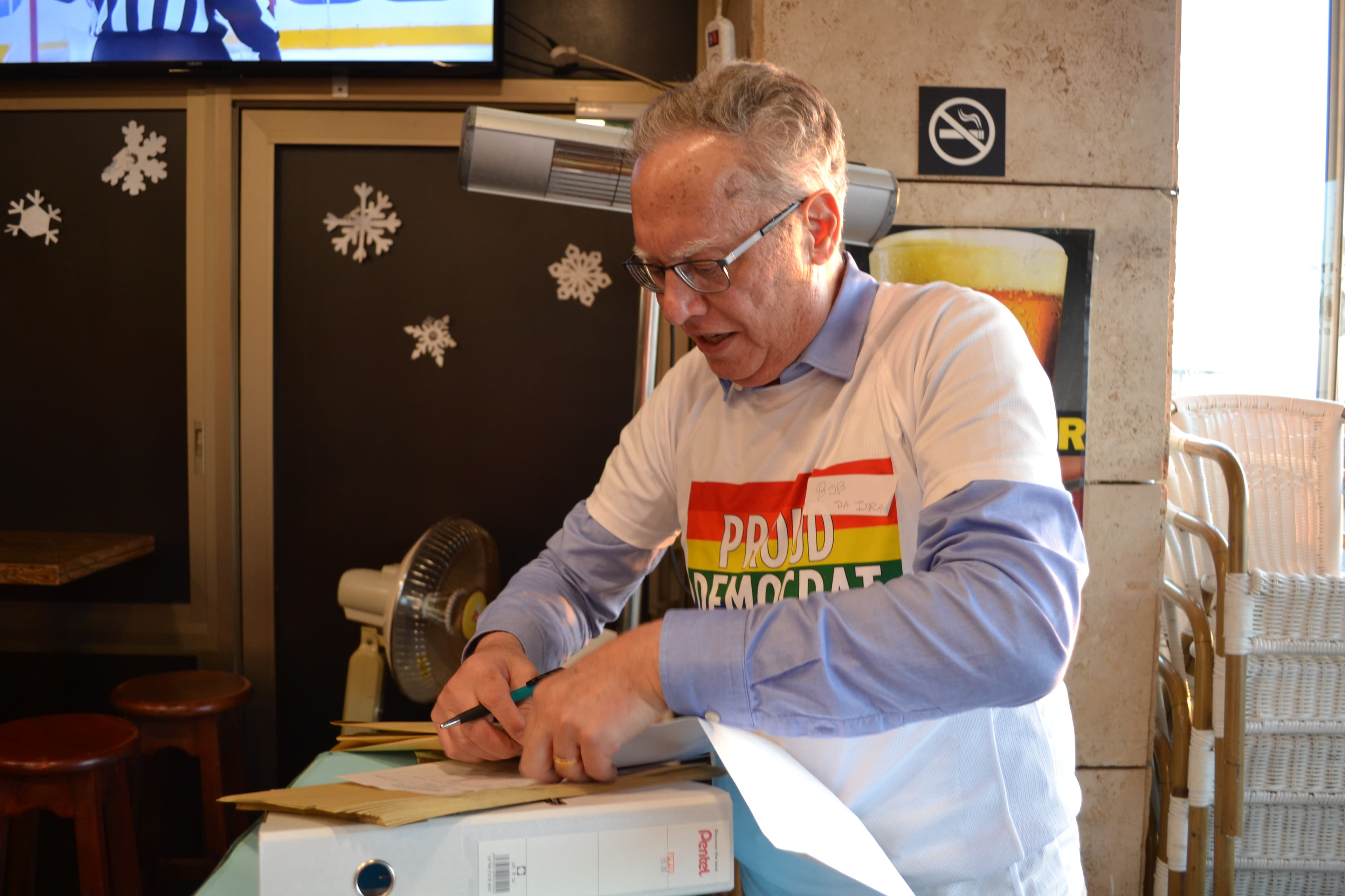 Bob Golub gets ready to deliver the vount count to Democrats Abroad Israel.