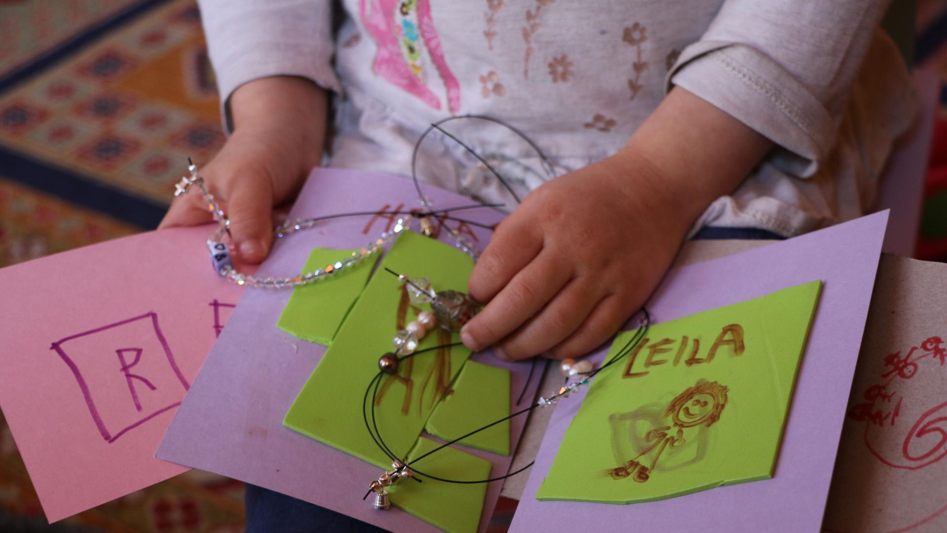 The author's 3-year-old daughter Leila has been occupying herself during the "stay at home" order in Boston amid the coronavirus outbreak by making cards and beaded necklaces for her preschool friends. 