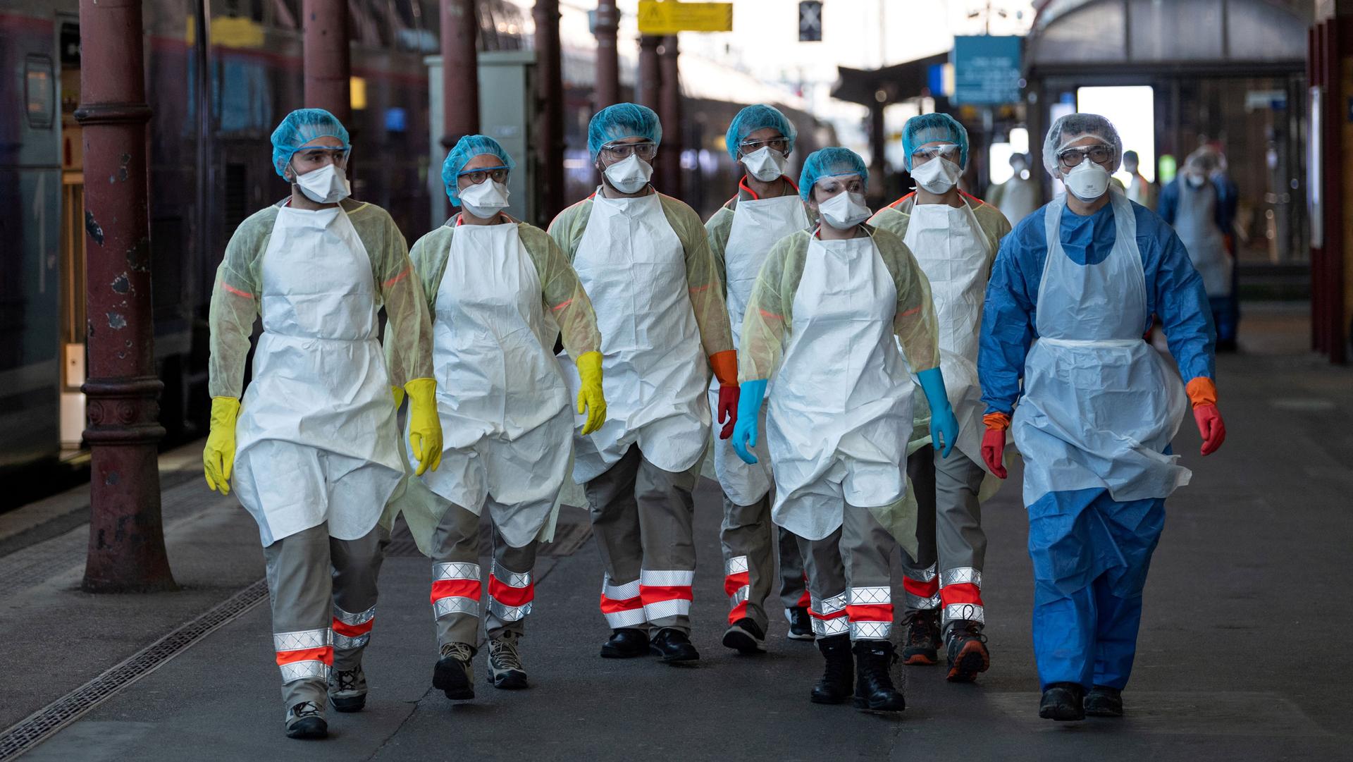 A group of people in PPE