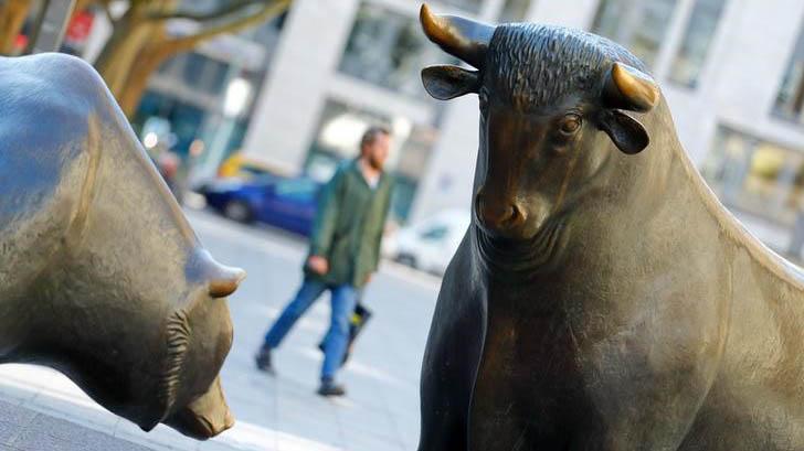 Bull and bear, symbols for successful and bad trading are seen in front of the German stock exchange