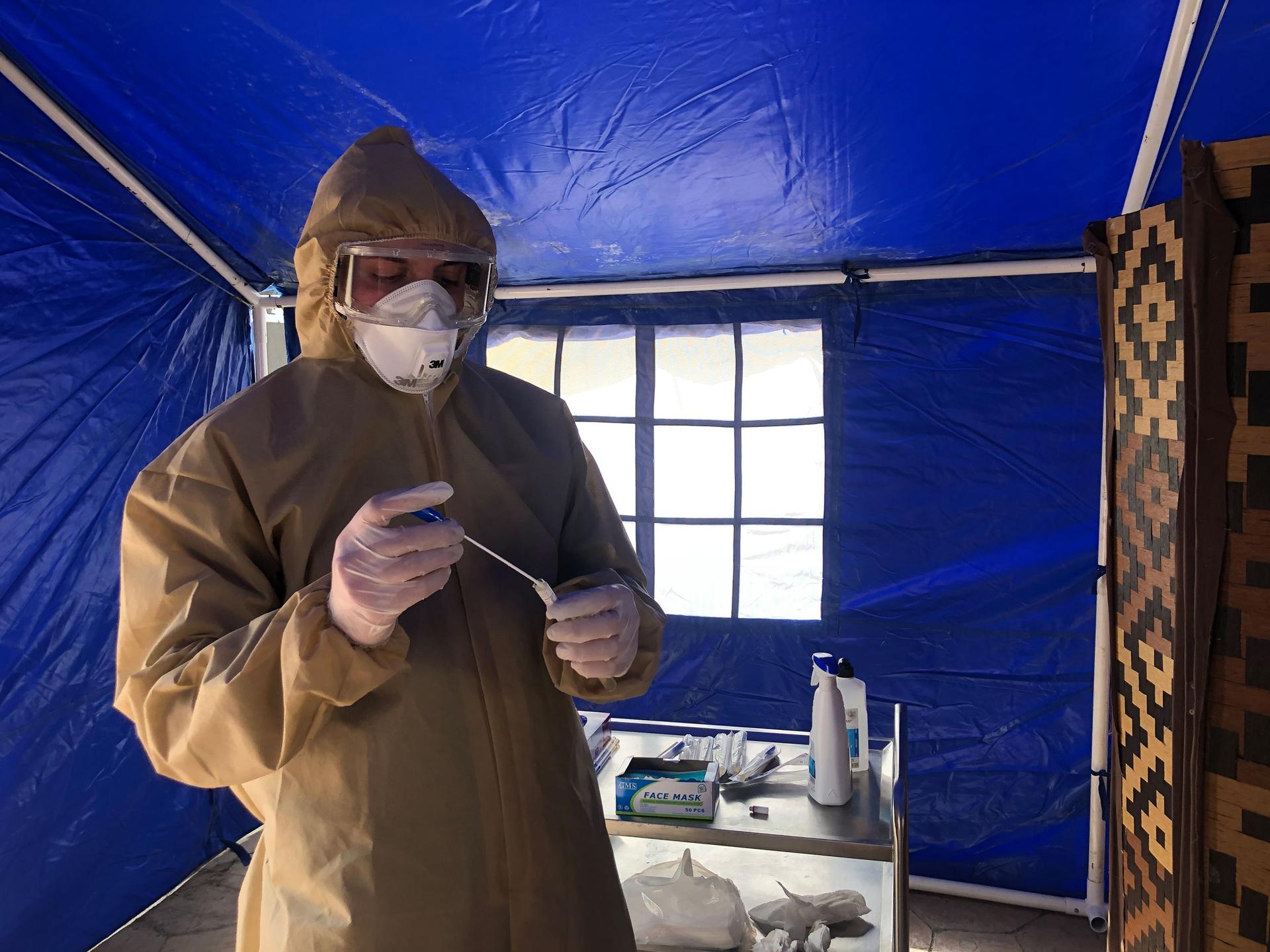 A man in personal protective equipment