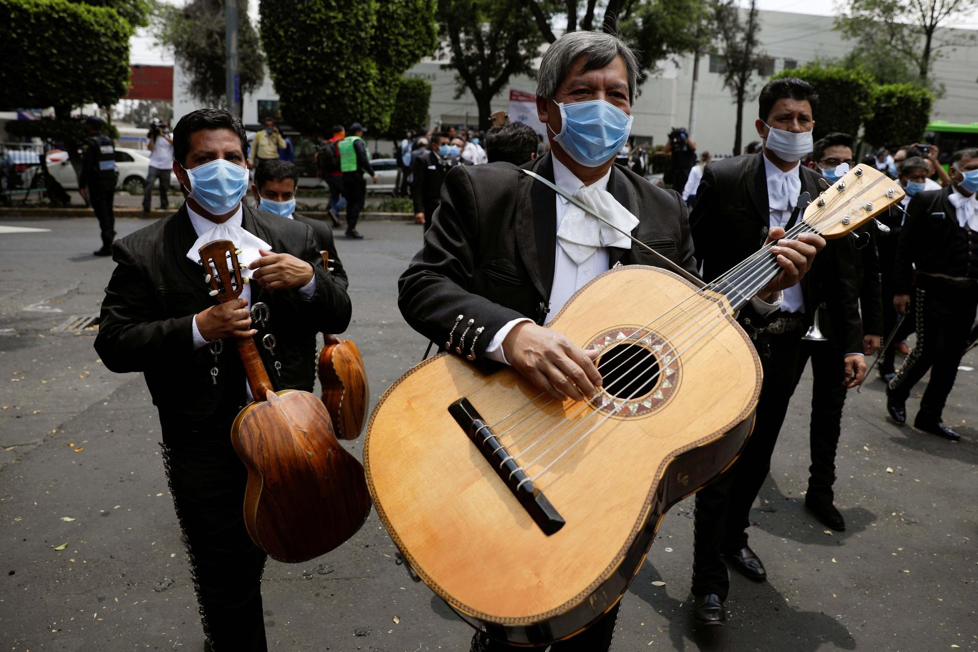 Members of a mariachi band wearing masks are seen after delivering a serenade for the medical staff of the National Institute of Respiratory Diseases during the coronavirus outbreak, in Mexico City, Mexico, April 7, 2020.