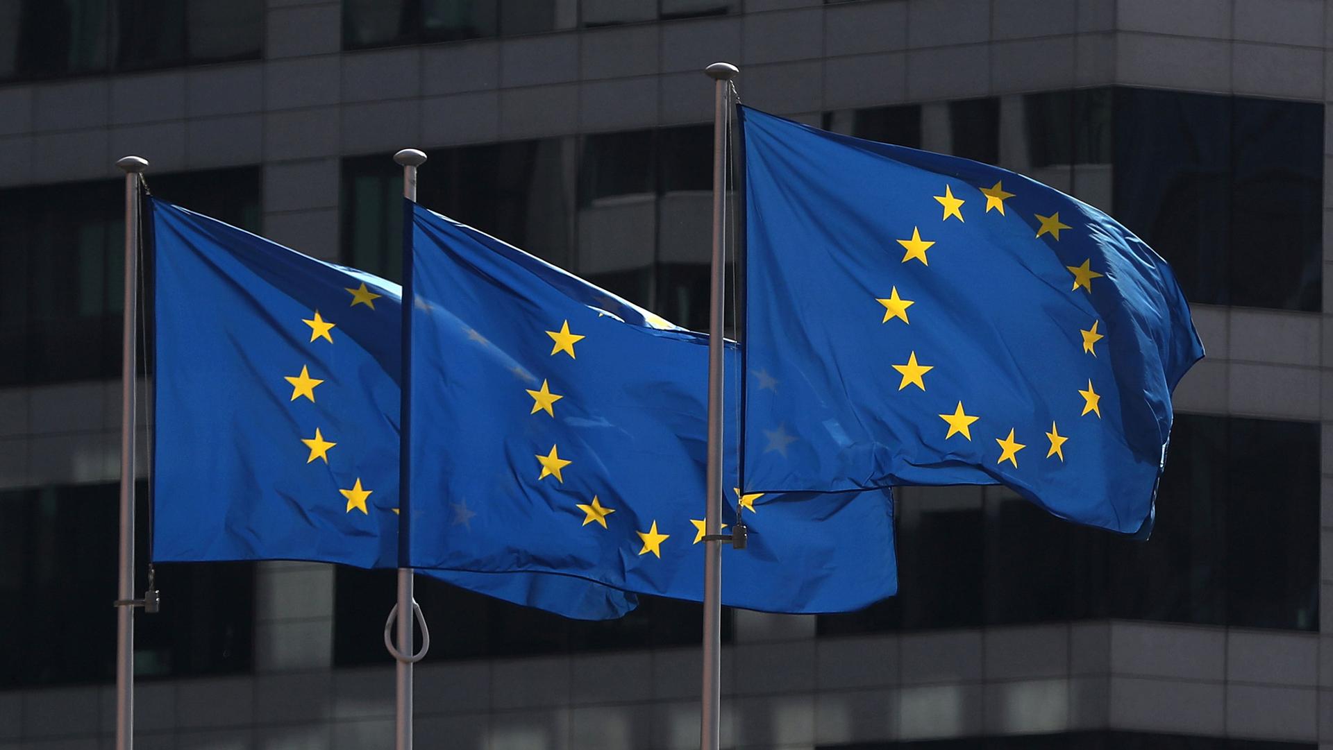 European Union flags fly outside the European Commission headquarters in Brussels, Belgium