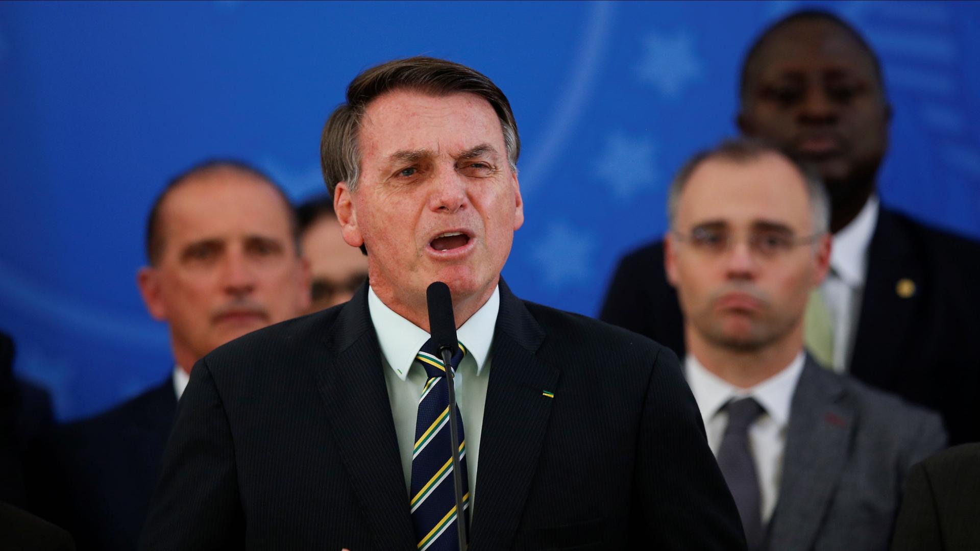 Brazil's President Jair Bolsonaro reacts while addressing the media during a news conference at the Planalto Palace in Brasilia, Brazil, April 24, 2020. 