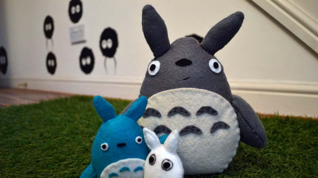 A stuffed animal Totoro and other characters from the 1988 Japanese anime film "My Neighbor Totoro."