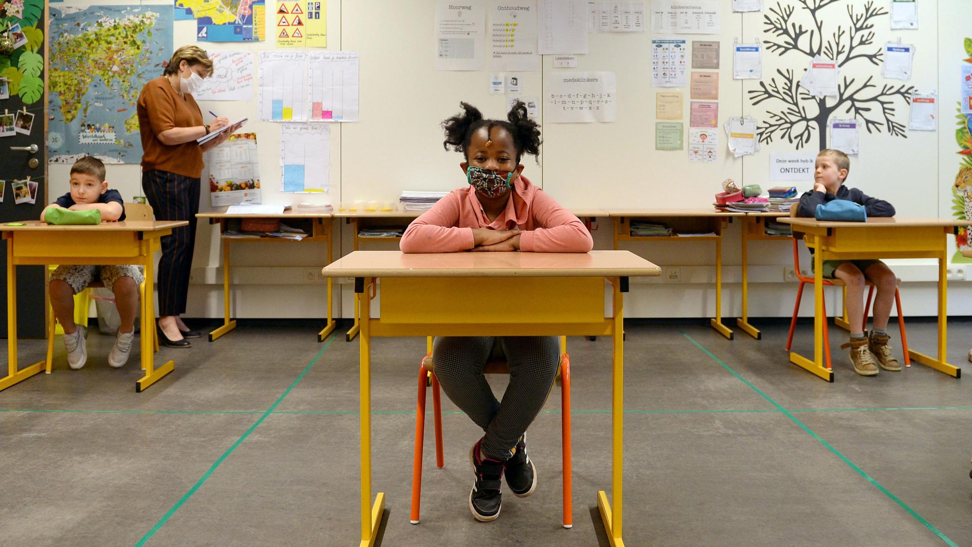 A child at a desk 