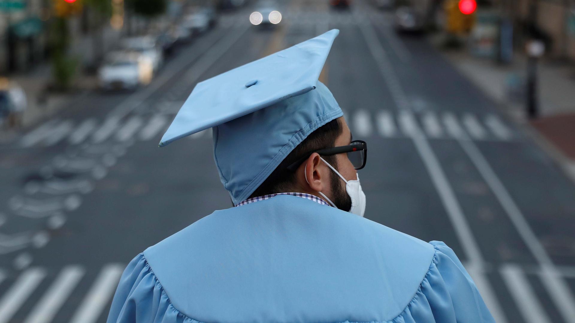 A graduating Masters student from the Columbia University stands on campus the day before his graduation ceremony, which is to be held online due to the outbreak of the coronavirus disease in New York City, on May 19, 2020.