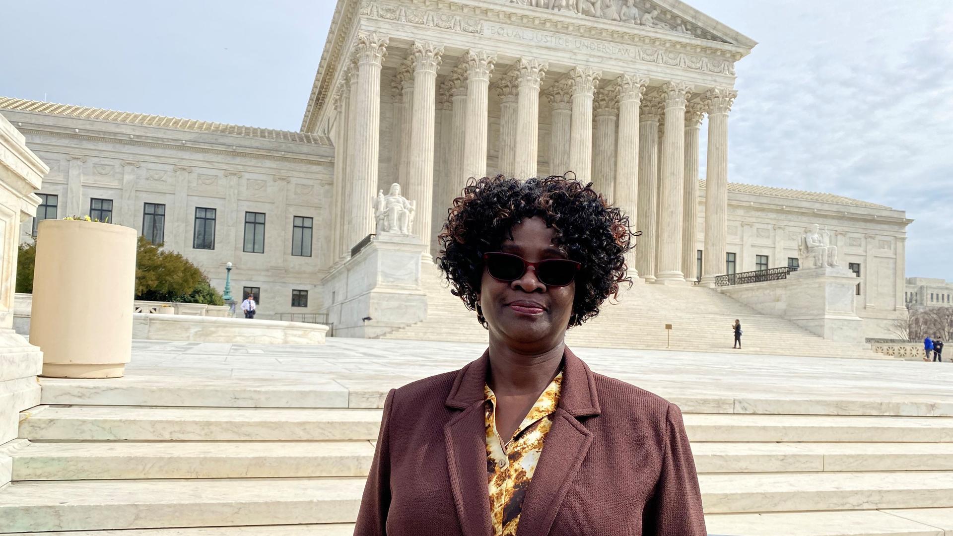 Doreen Oport, who was injured in the attack on the US Embassy in Nairobi, Kenya in 1998, stands outside the US Supreme Court after oral arguments in Washington, Feb. 24, 2020. 