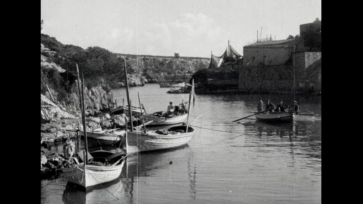 A seaside image of boats in Mallorca in black and white
