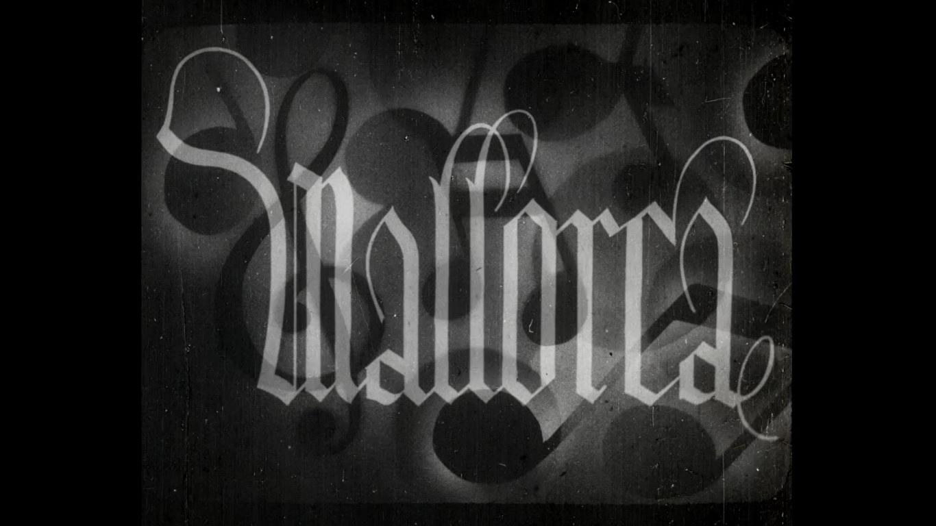 The word Mallorca in gothic lettering in black and white