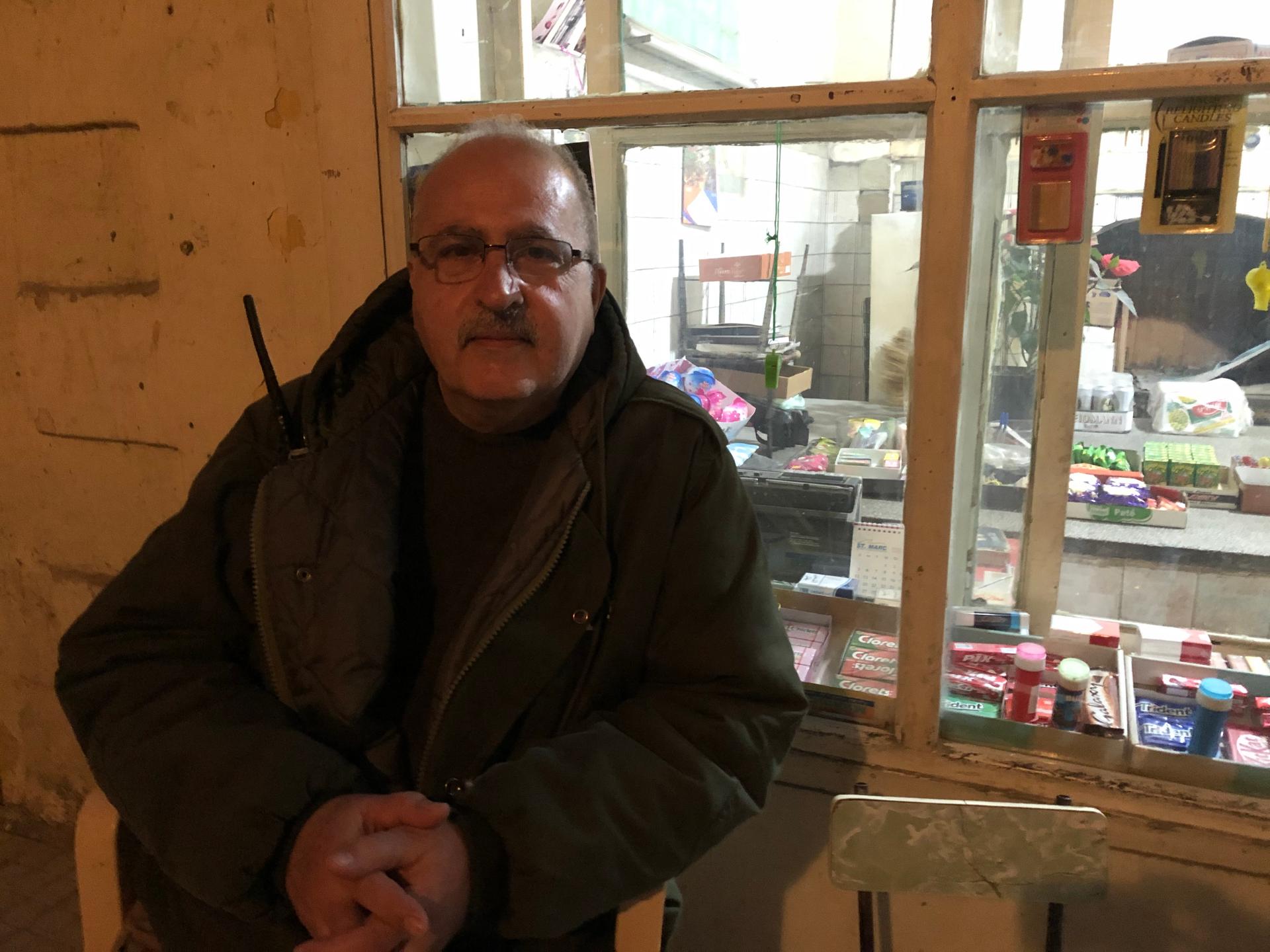 Baruyr Solakian sits outside a shop in Beirut's Bourj al-Hammoud neighborhood.