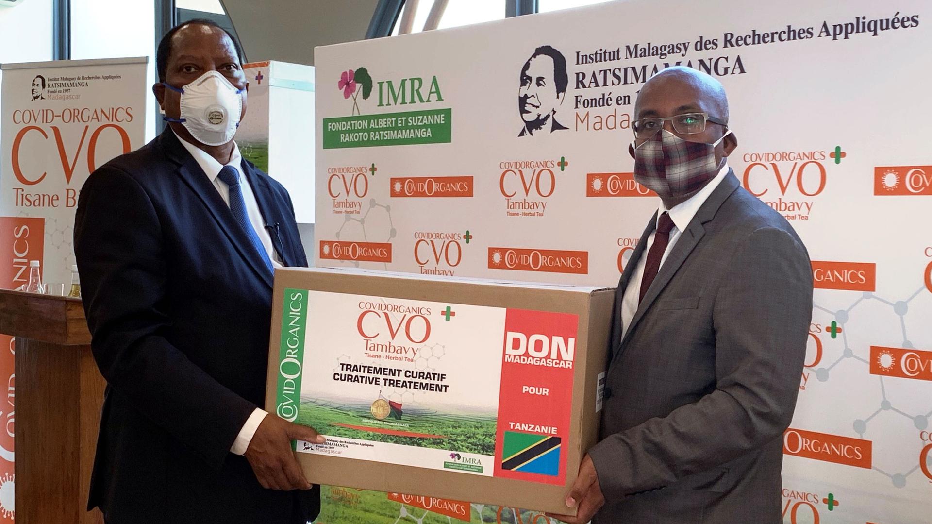 Palamagamba Kabudi, Tanzania's Foreign Minister receives a package from his Madagascar counterpart Tehindrazanarivelo Djacoba of the COVID Organics