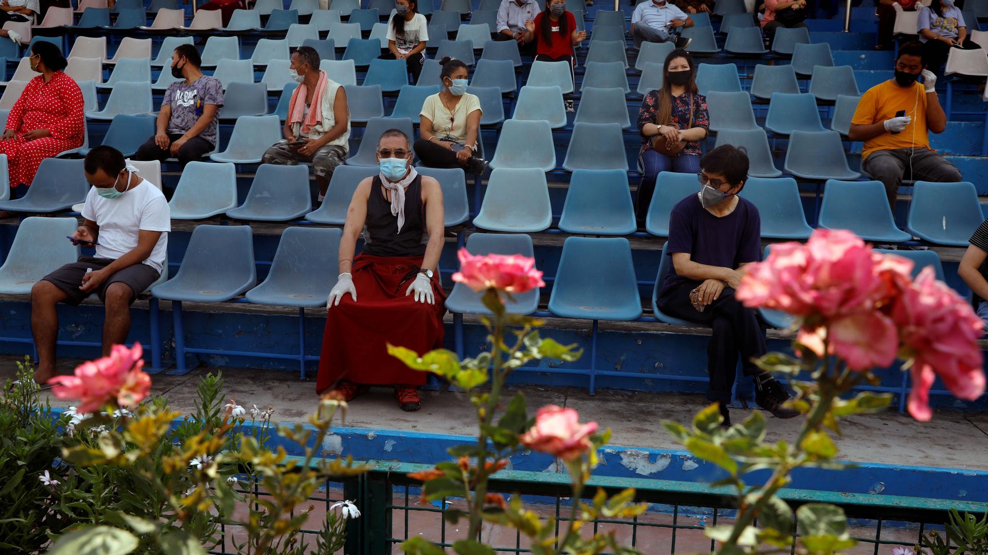Stranded residents of Ladakh, a union territory in India, wait in a stadium for being thermal screened before taking buses back to Ladakh, after few restrictions were lifted by Delhi government during an extended nationwide lockdown to slow the spread of 