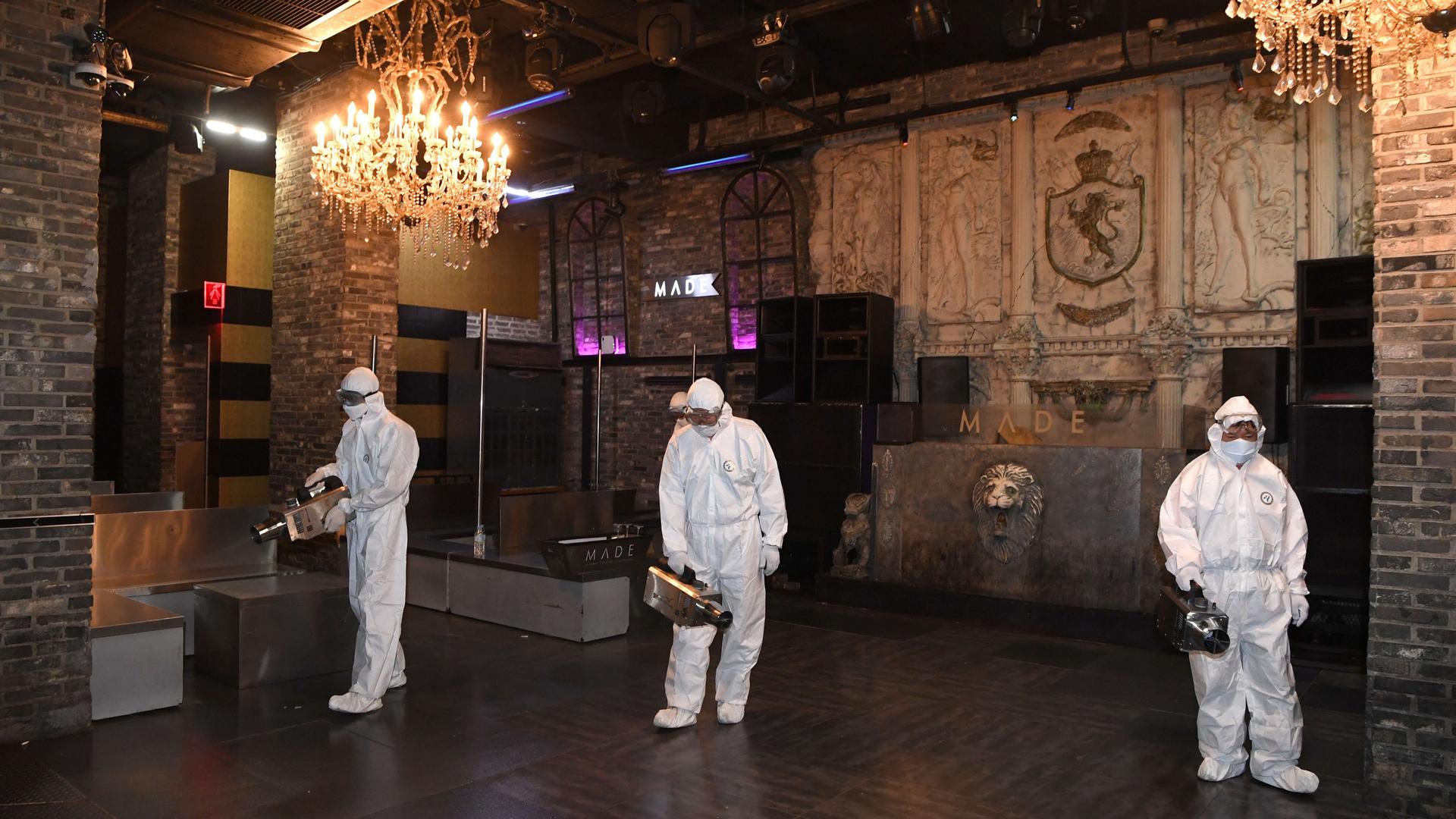 Quarantine worker spray disinfectants at a night club on the night spots in the Itaewon neighborhood, following the coronavirus disease (COVID-19) outbreak, in Seoul, South Korea, May 12, 2020. 