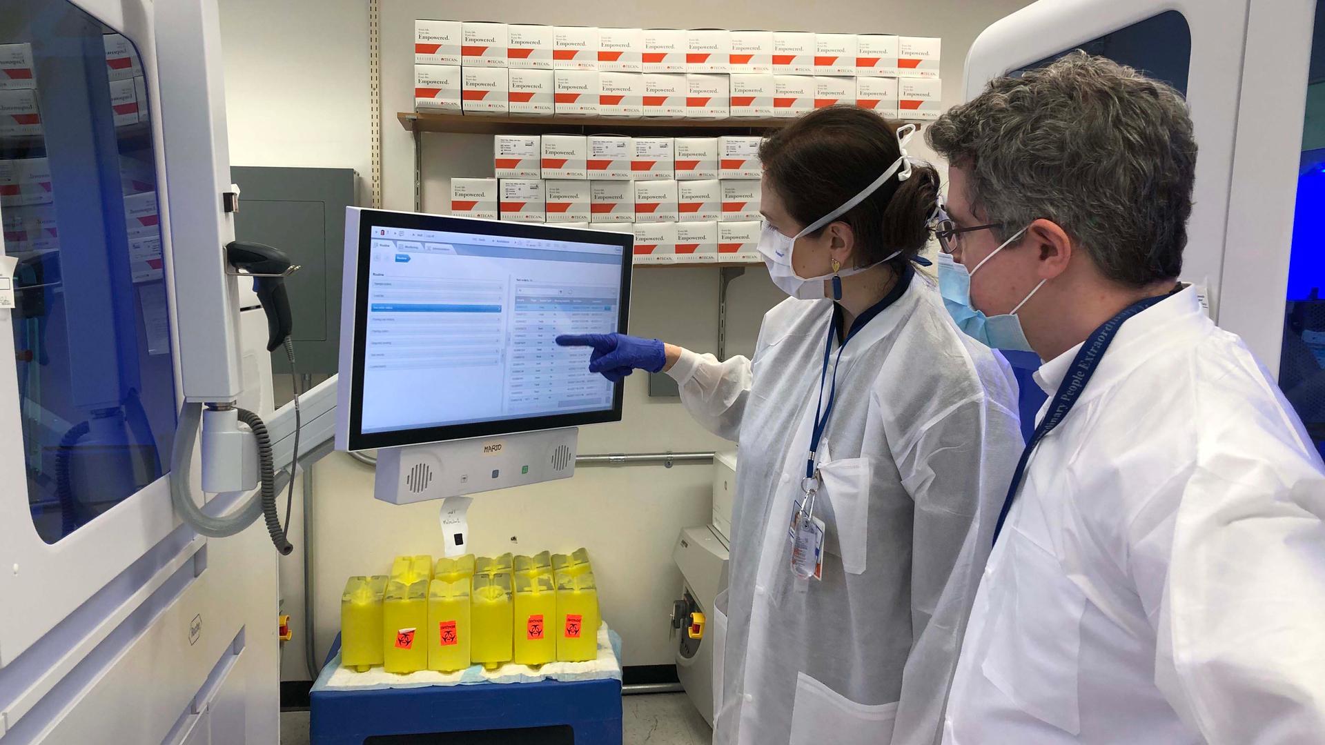 Geneticist Harm van Bakel, right, has been racing to map the new coronavirus at the Icahn School of Medicine at Mount Sinai in New York City.
