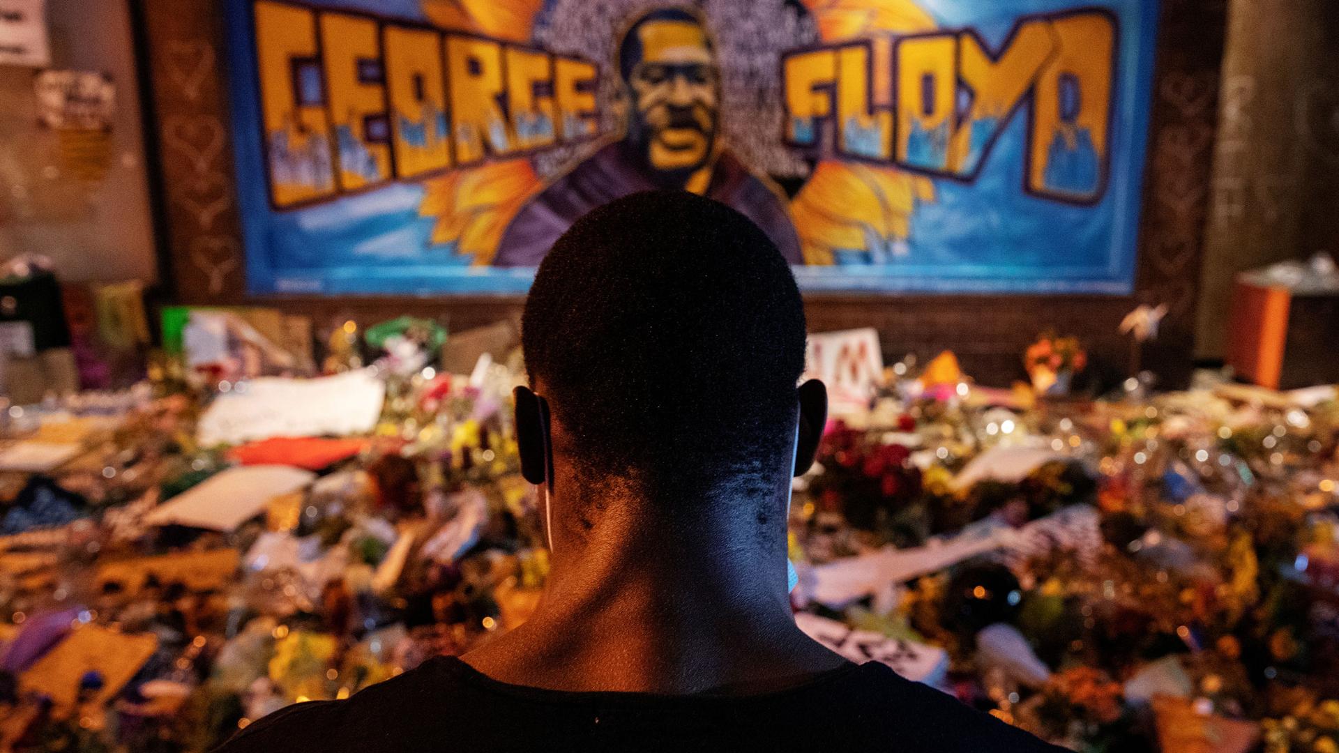 A man recites spoken word poetry at a makeshift memorial honoring George Floyd at the spot where he was taken into custody, in Minneapolis, June 1, 2020.