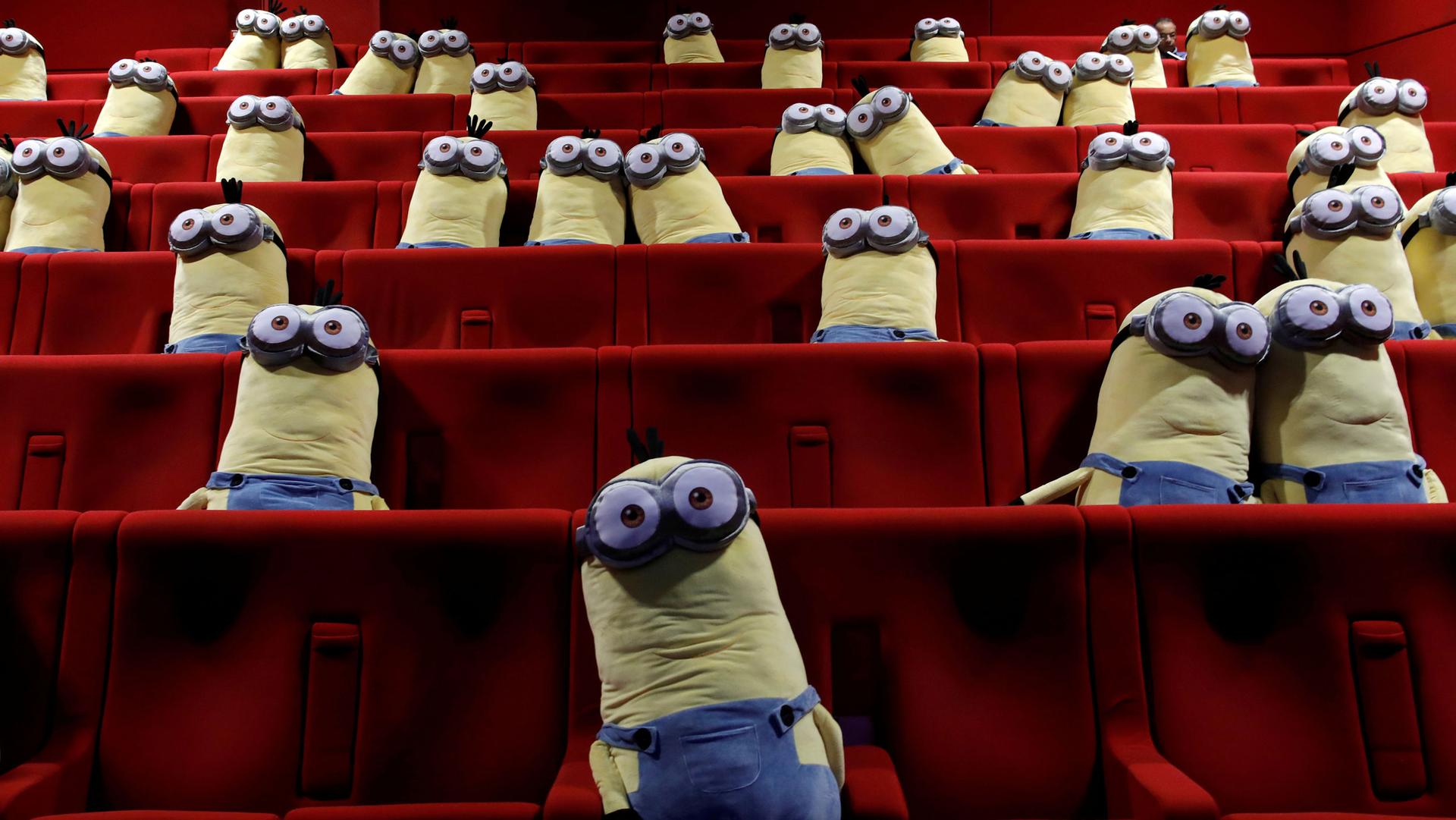 Stuffed Minion dolls are seen in theater seats