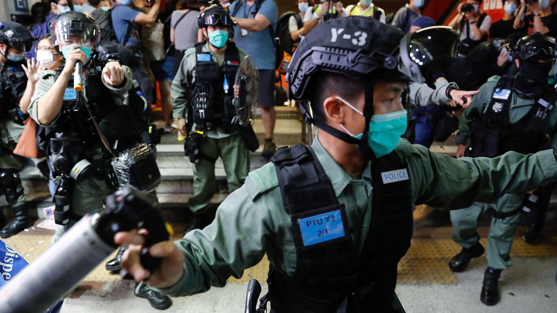 Riot police disperse pro-democracy demonstrators