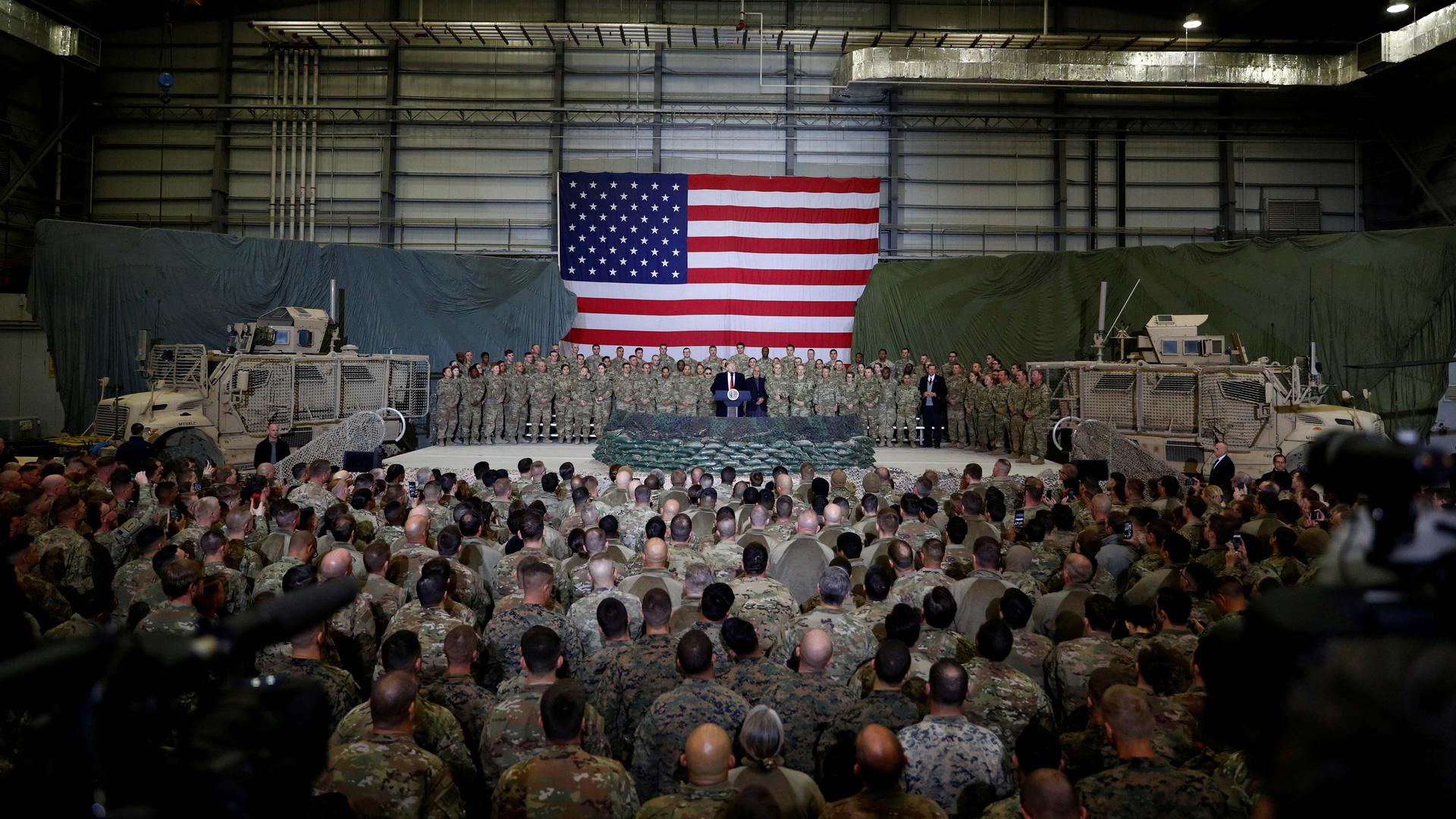 US President Donald Trump delivers remarks to US troops during an unannounced visit to Bagram Air Base, Afghanistan on November 28, 2019.