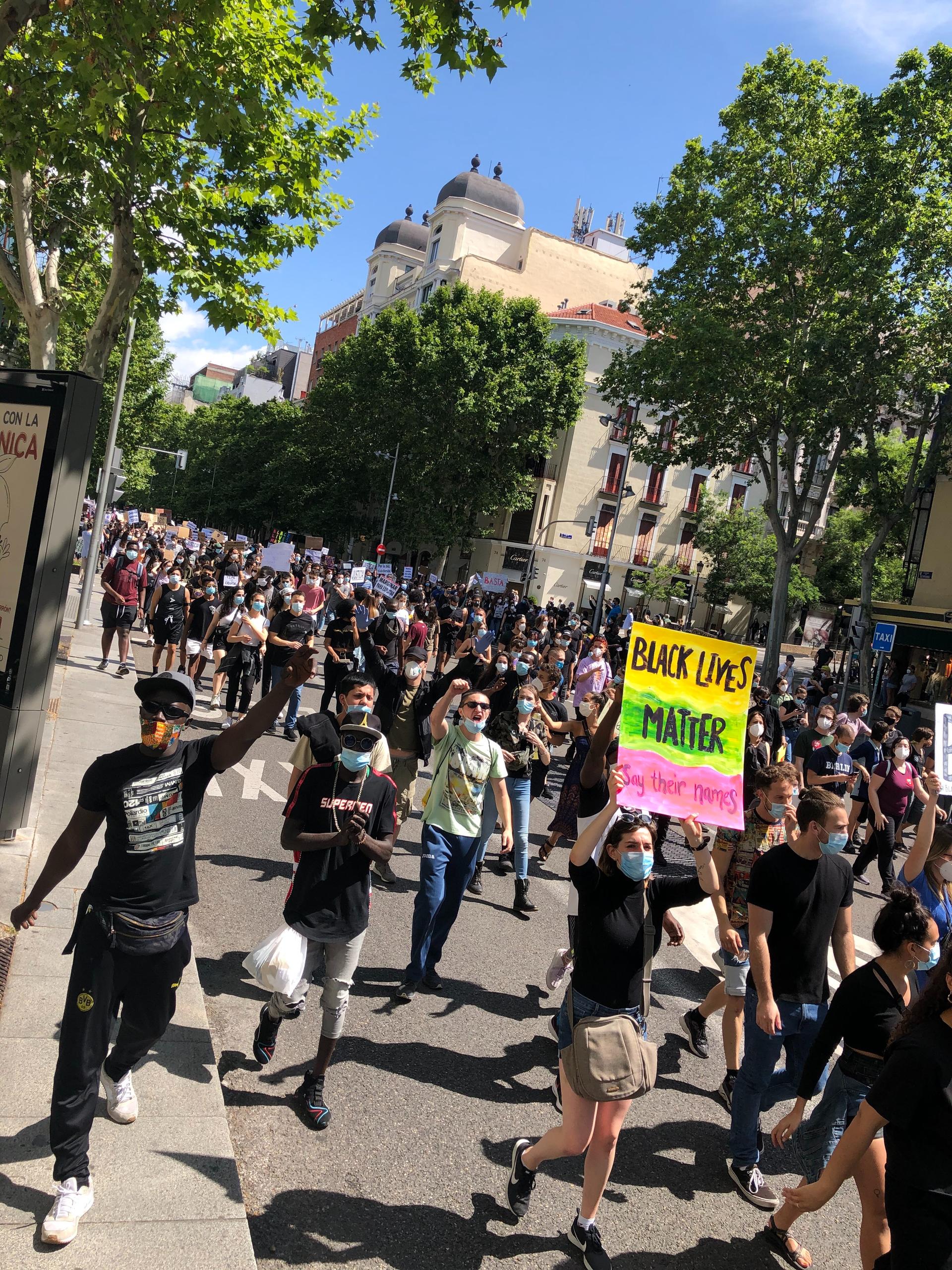 Protesters marched on June 7 in Madrid, Spain, holding signs with anti-racist slogans.