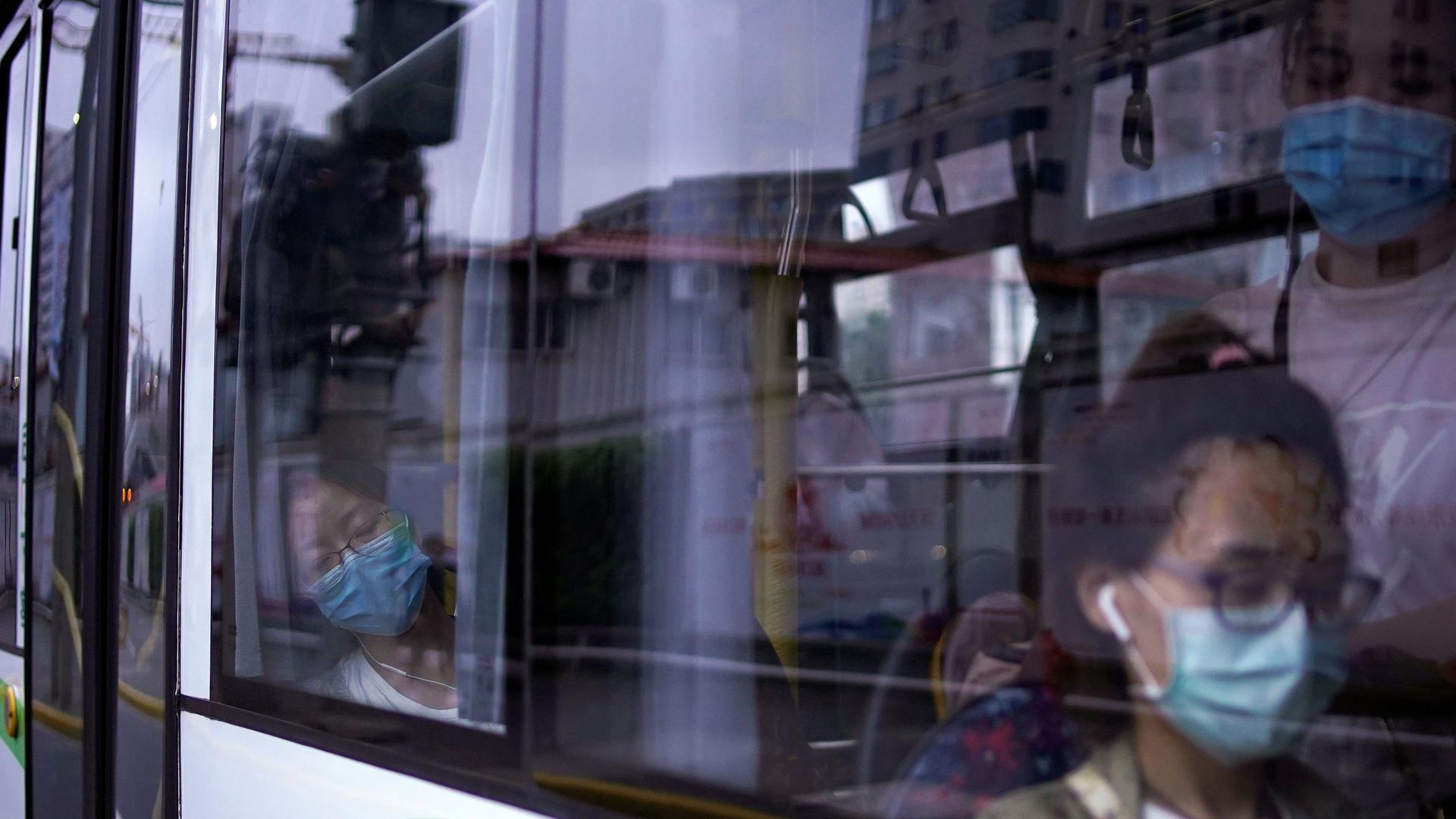 Women wearing protective face masks are seen in a bus, following the coronavirus disease (COVID-19) outbreak, in Shanghai, June 9, 2020. 
