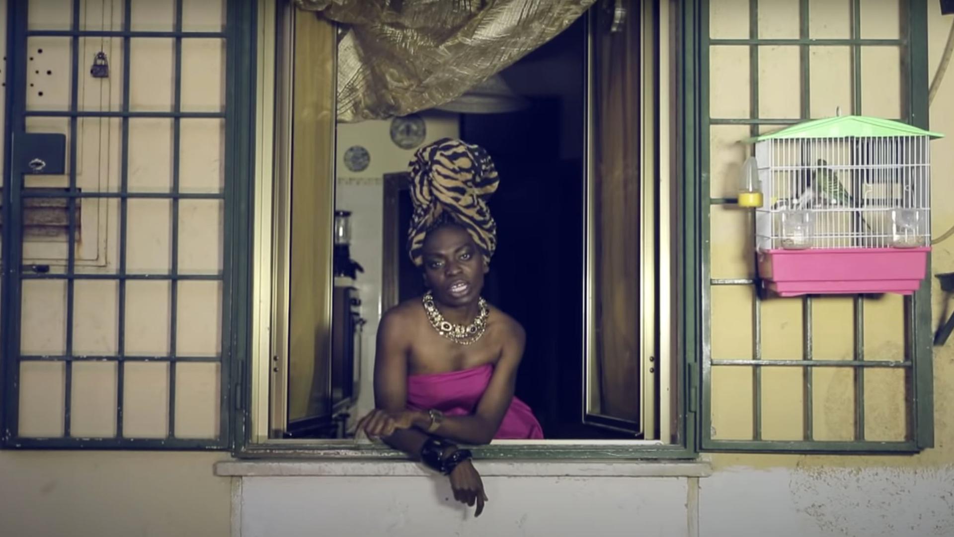 A screenshot from Liberian Italian artist Karima 2G's 2014 music video, "Bunga Bunga," in which she raps about racism and objectification of women.