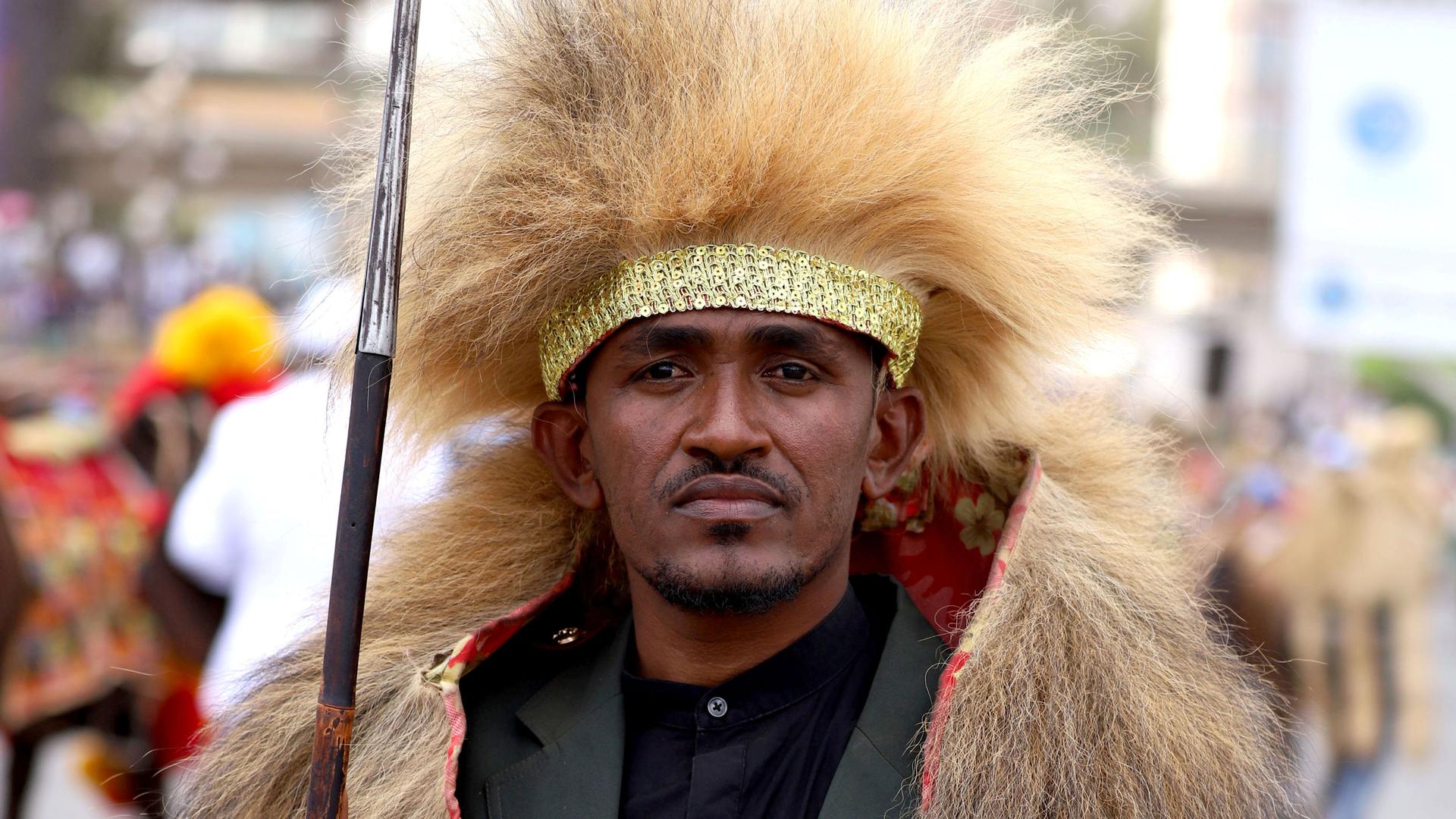 A close up of a man in traditional Oromo clothing