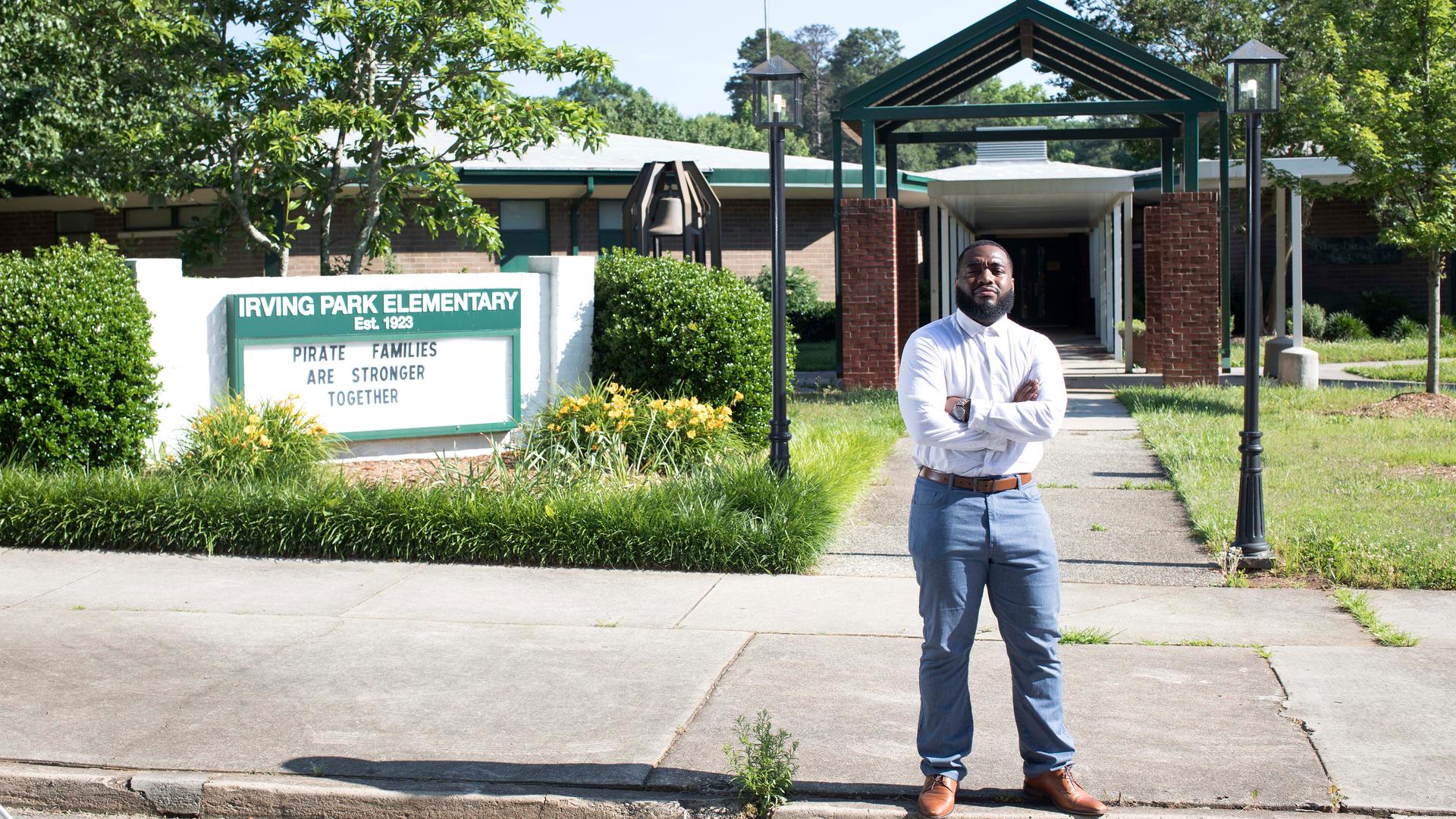 Brayan Guevara in front of Irving Park Elementary School, in Greensboro, North Carolina, where he is a teacher's assistant, June 3, 2020.