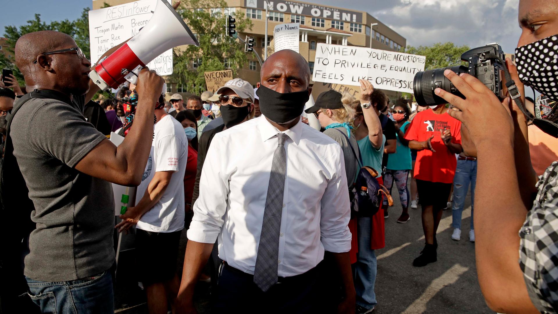 Kansas City mayor Quinton Lucas, center, walks among protesters Wednesday, June 3, 2020, in Kansas City, Mo., during a unity march to protest against police brutality following the death of George Floyd.