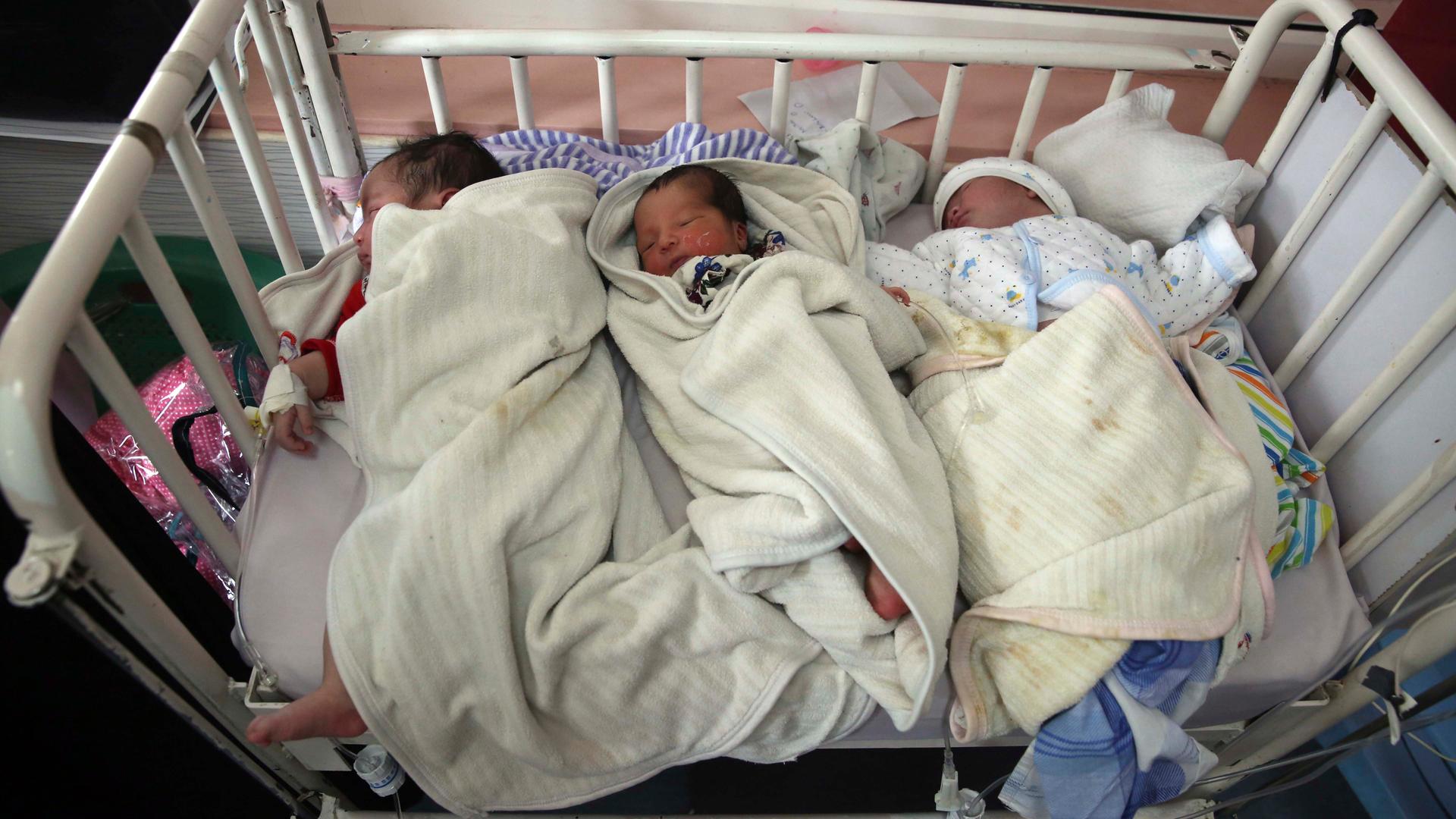 Newborn babies lie in their beds at the Ataturk Children's Hospital a day after they were rescued following a deadly attack on another maternity hospital, in Kabul, Afghanistan, May 13, 2020. 