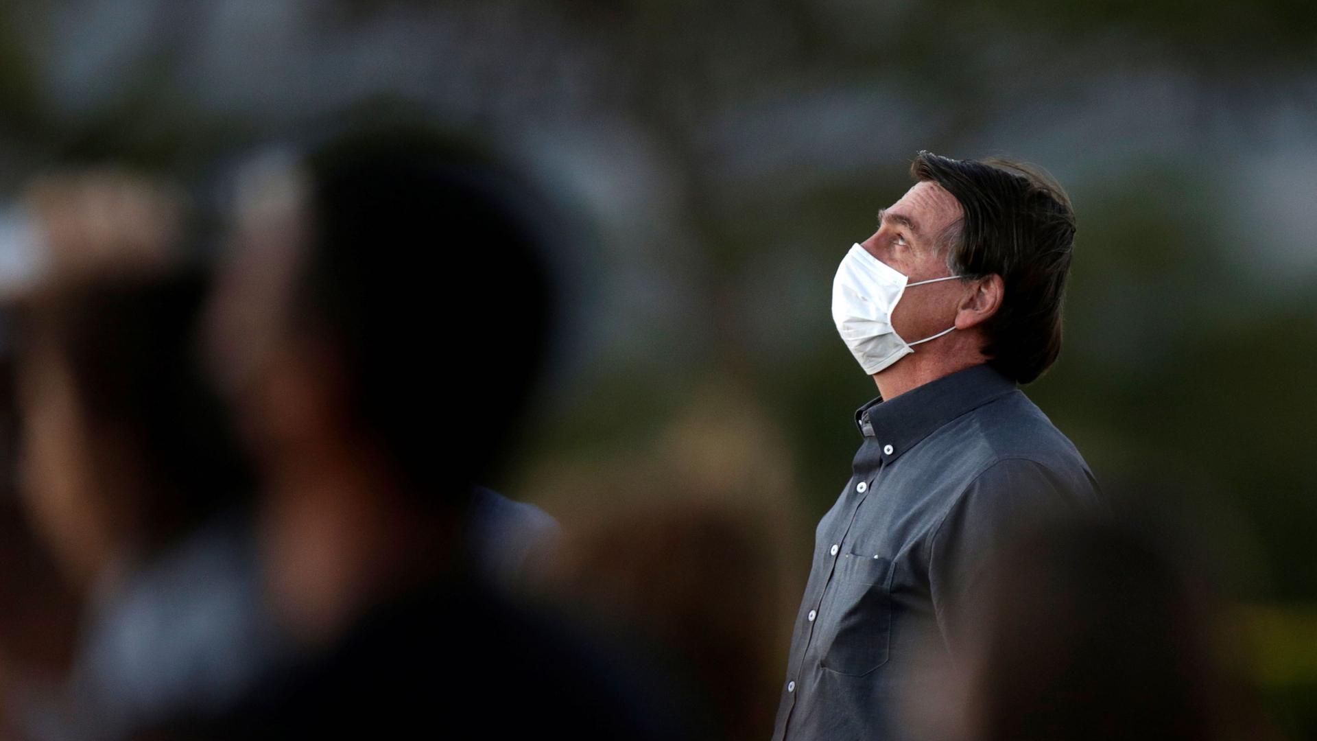 Brazil's President Jair Bolsonaro is seen during a ceremony to lower the Brazilian National flag down for the night, at the Alvorada Palace, amid the coronavirus outbreak in Brasília, Brazil, July 20, 2020.
