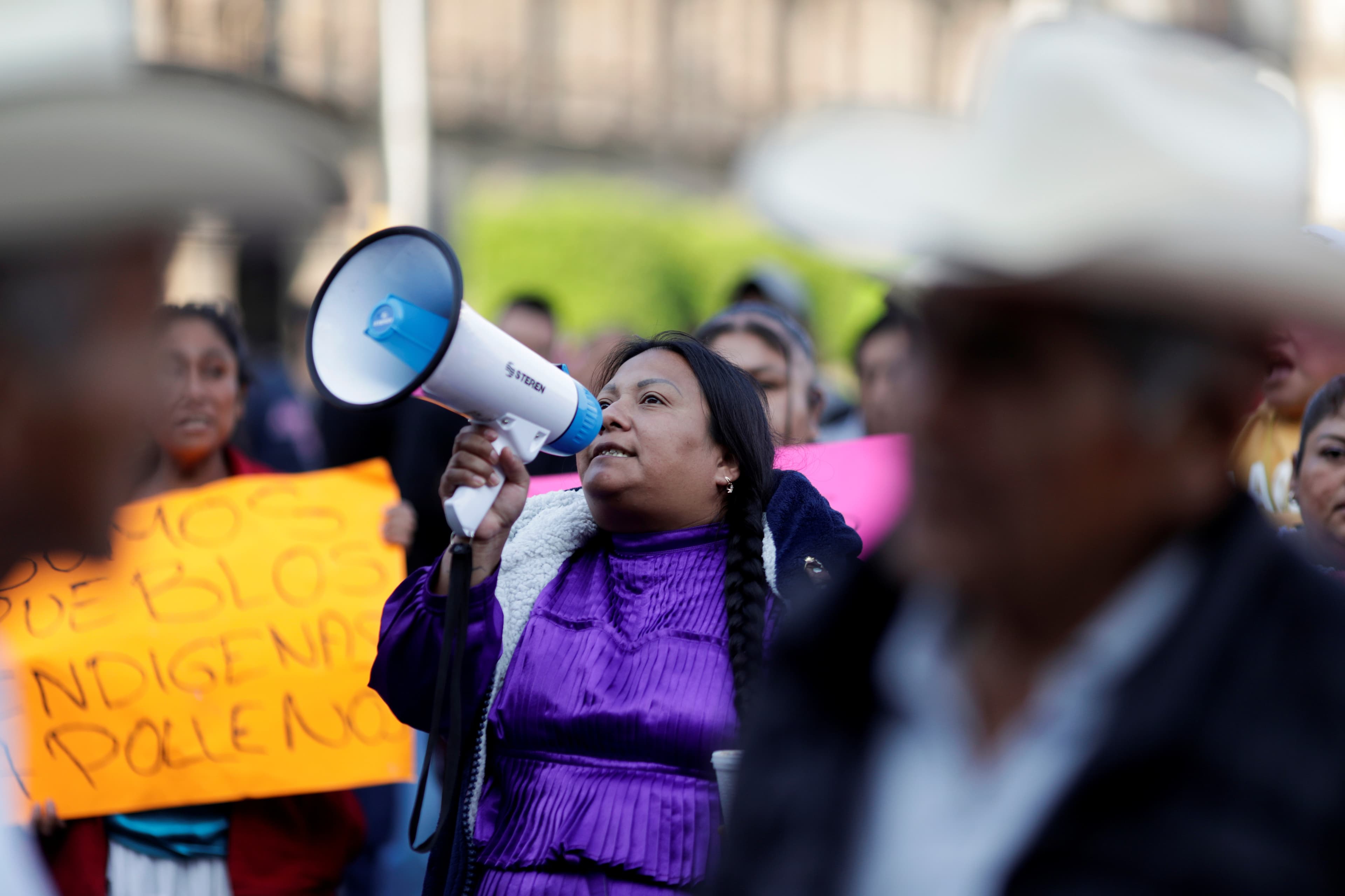 Oaxaca's artisans take part in a protest outside the National Palace to demand the federal government help for the loss of jobs and decrease in their labor services, after the Mexican government declared a health emergency and issued stricter regulations