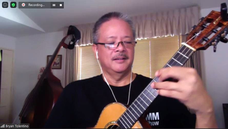 A Zoom screenshot of ukulele teacher Brian Tolentino playing “Somewhere Over the Rainbow.”