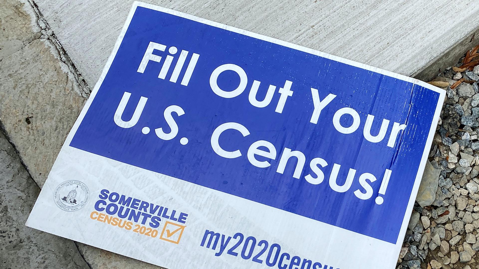 A blue and white census sign. 