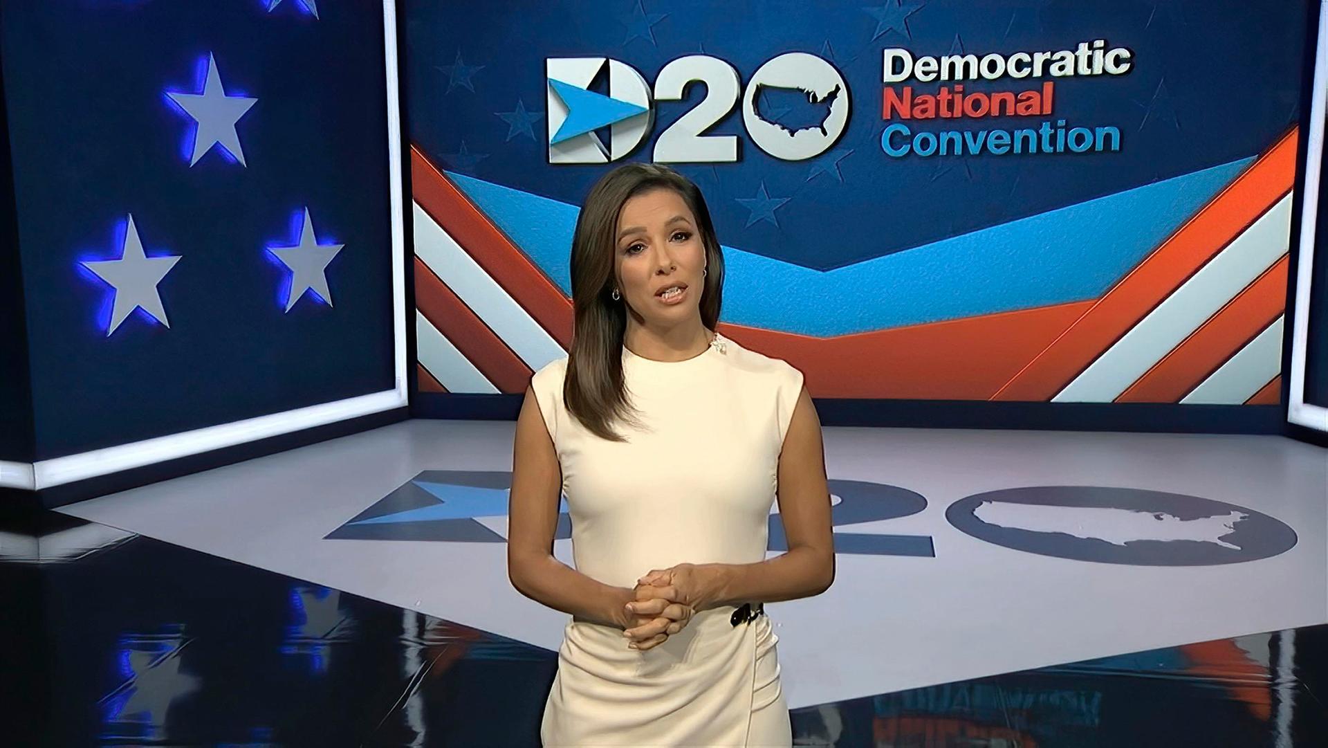 In this image from video, Eva Longoria, serving as moderator in a white dress against a blue screen, speaks during the first night of the Democratic National Convention on Aug. 17, 2020.
