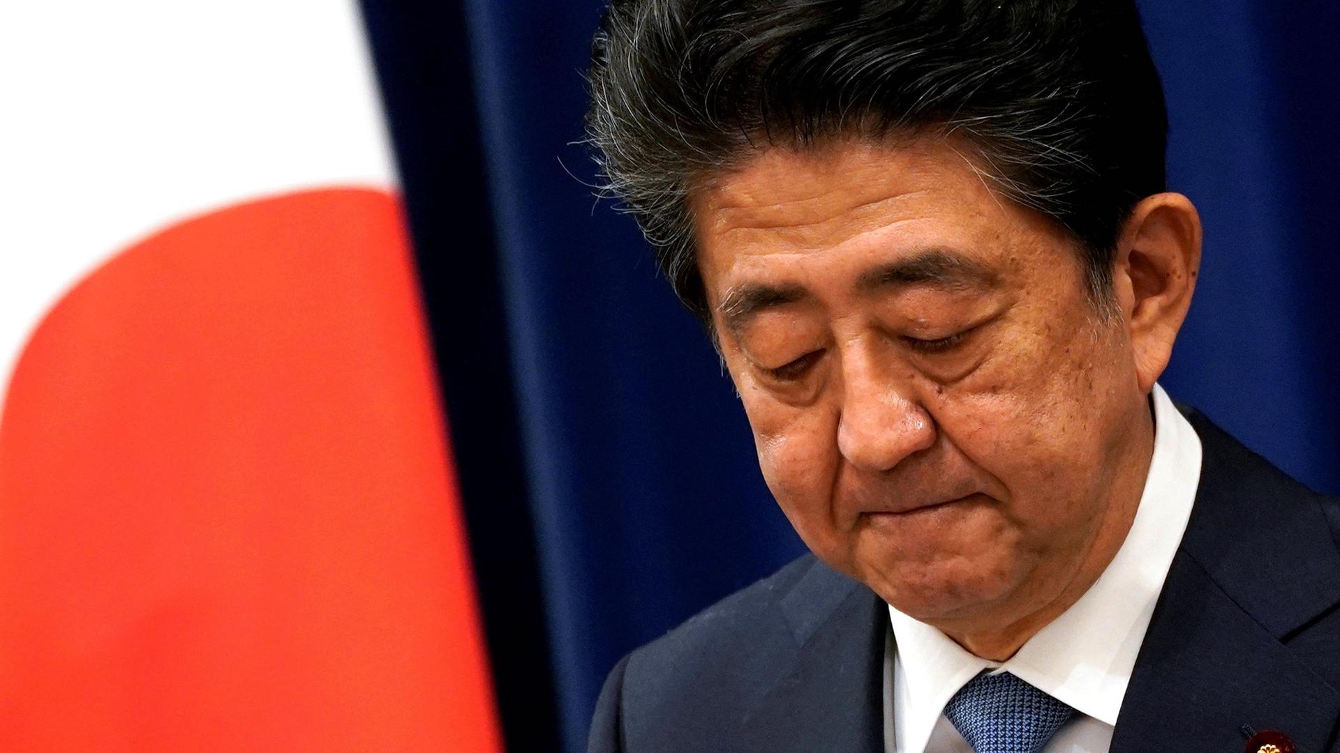 Japanese Prime Minister Shinzō Abe reacts during a news conference at the prime minister's official residence in Tokyo, Aug. 28, 2020.
