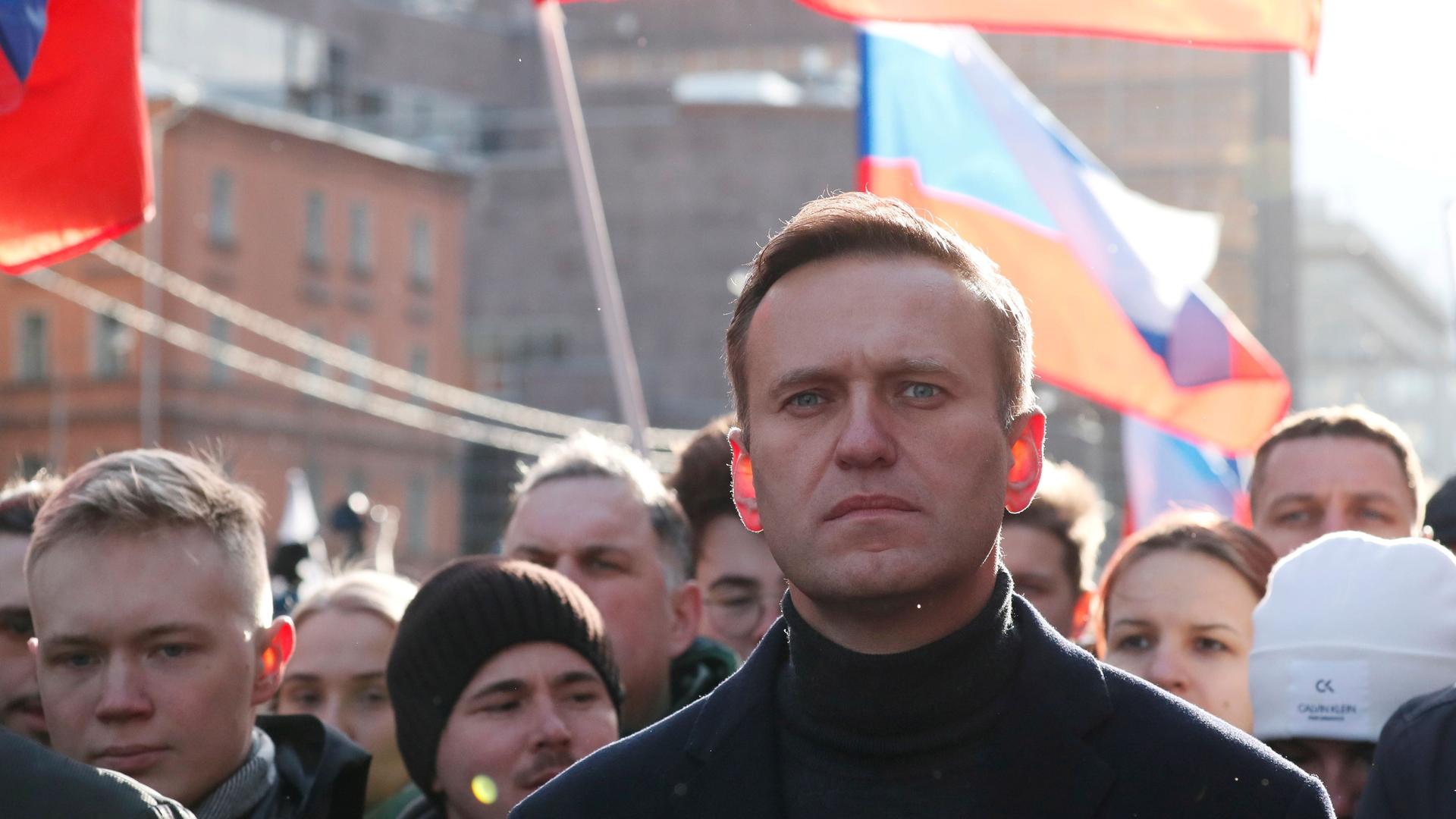 Russian opposition politician Alexei Navalny takes part in a rally to mark the 5th anniversary of opposition politician Boris Nemtsov's murder and to protest against proposed amendments to the country's constitution, in Moscow, Feb. 29, 2020. 