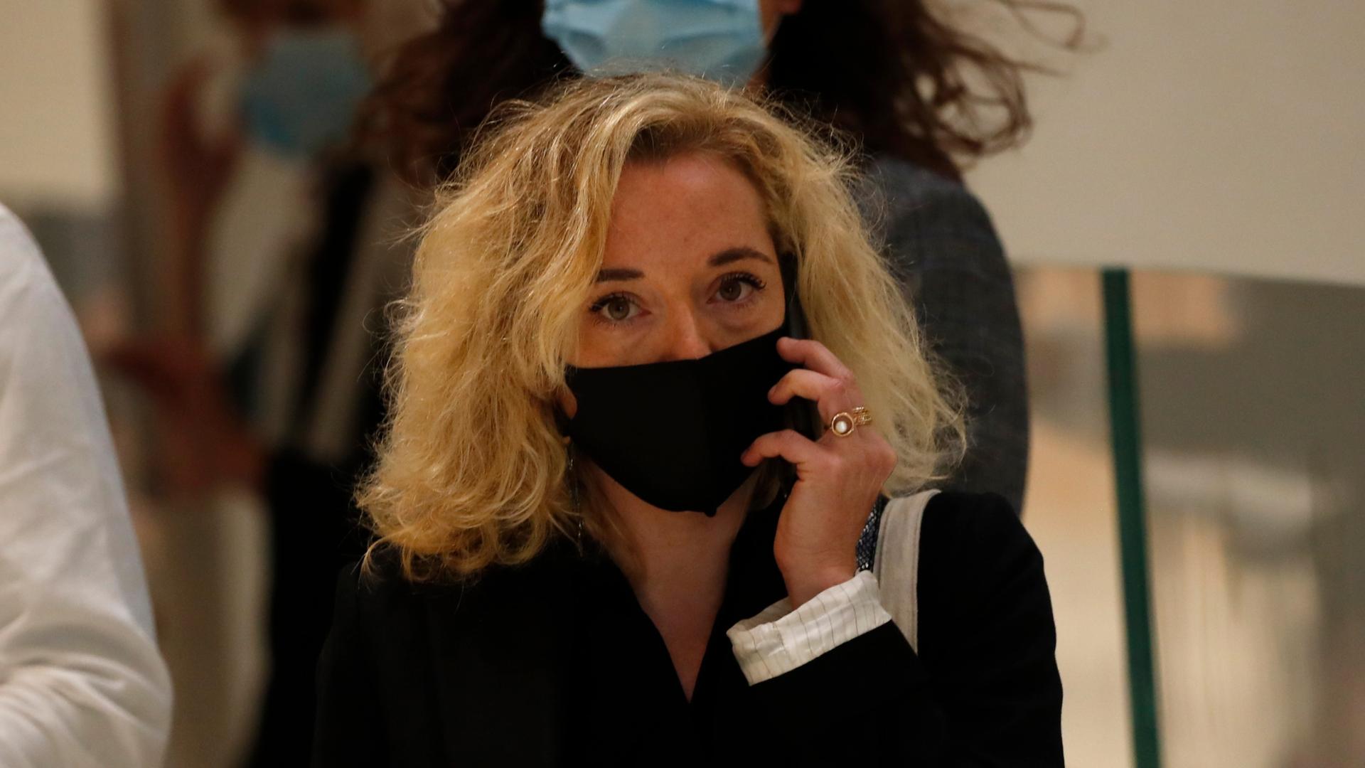 Chloe Verlhac, widow of Charlie Hebdo cartoonist Tignous, arrives at the courtroom for the opening of the 2015 attacks trial, Sept. 2, 2020, in Paris.