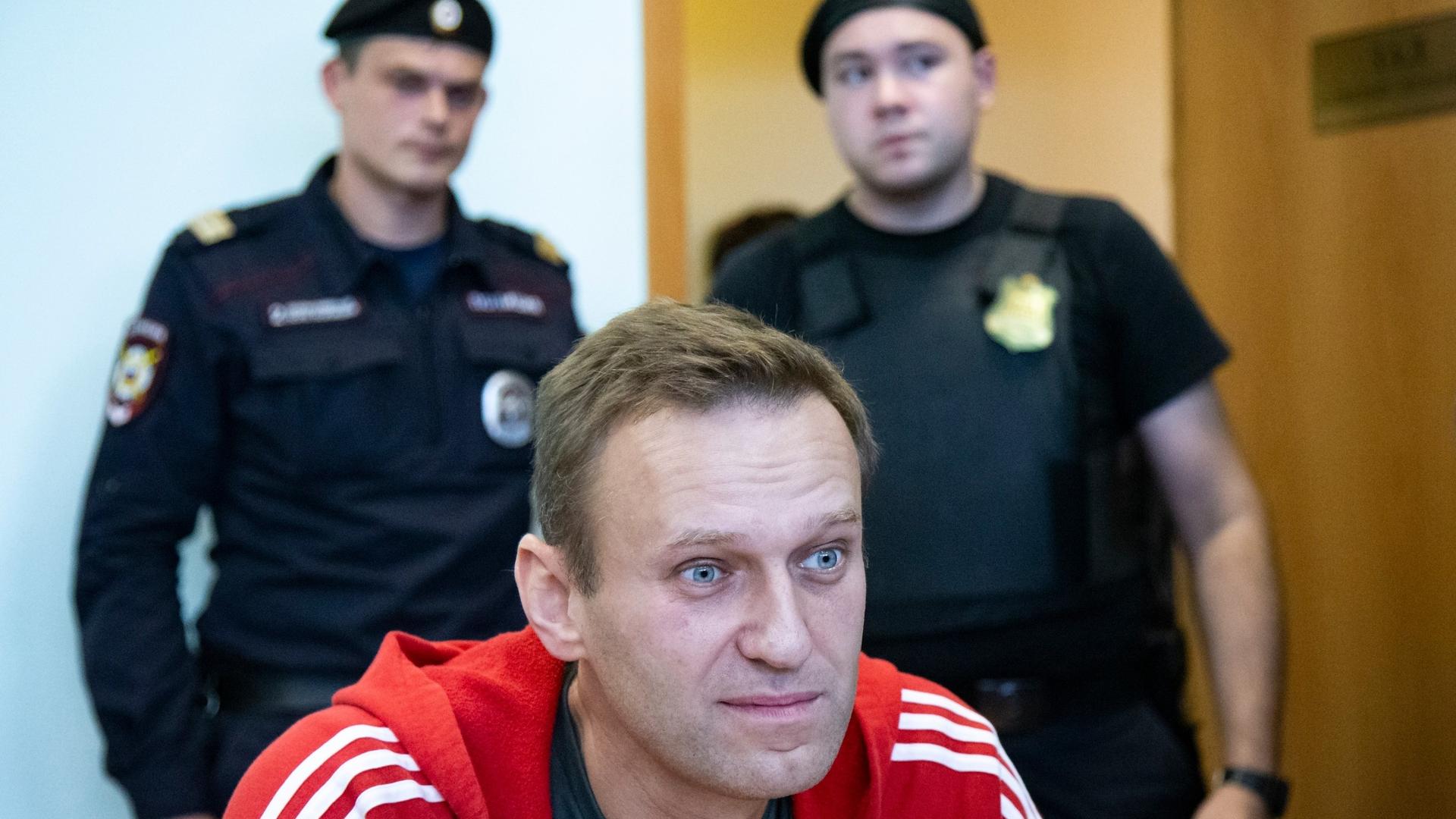 Russian opposition leader Alexei Navalny speaks to the media prior to a court session in Moscow, Russia.